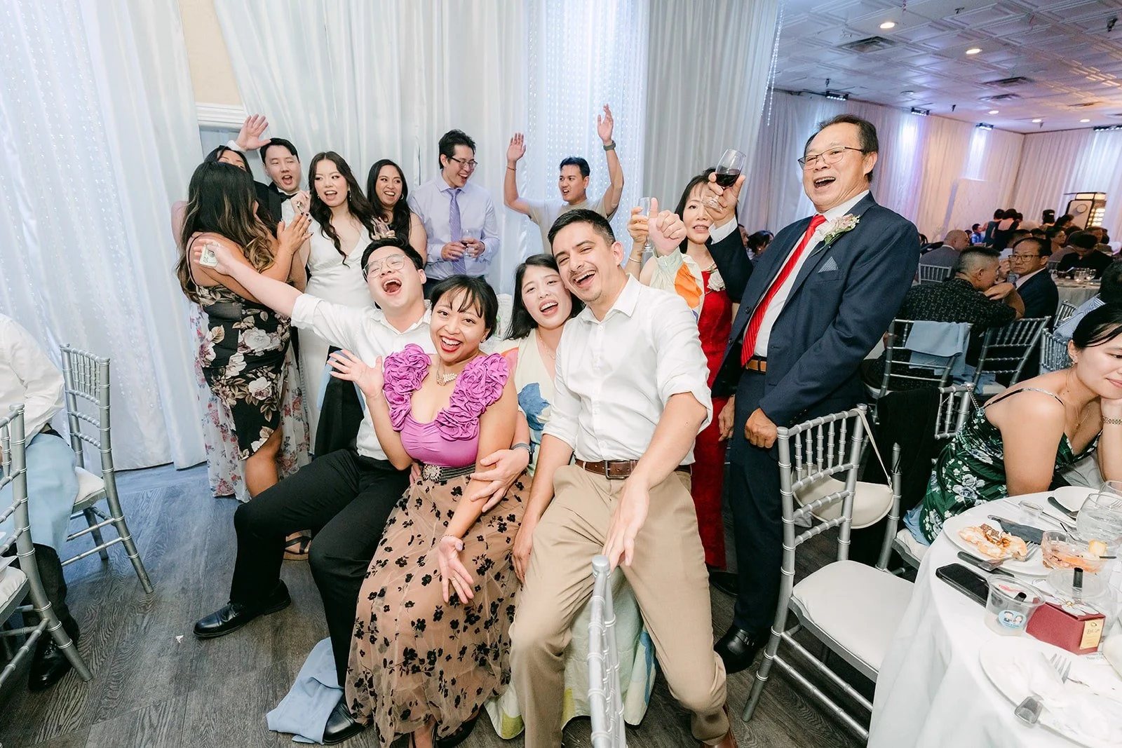 A full table posing with the couple