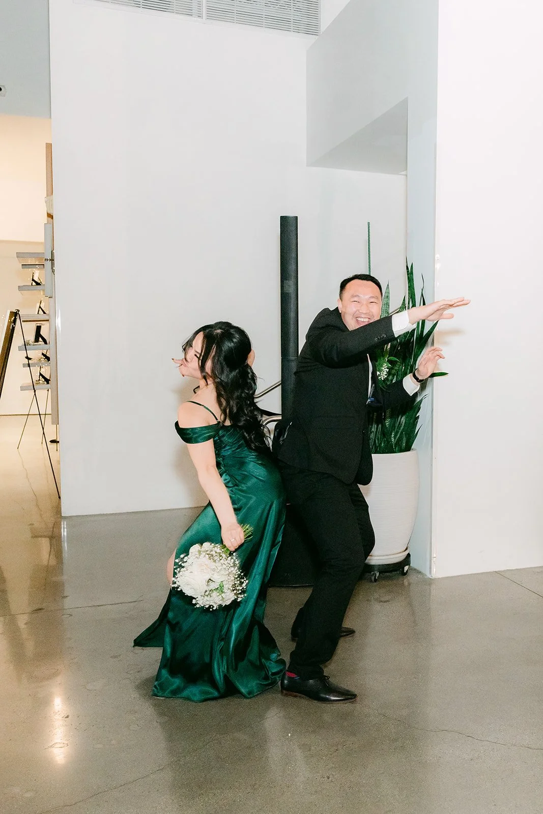 Bridesmaid and groomsman dancing into the reception