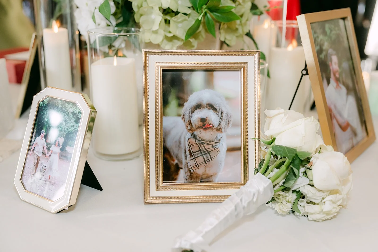 Framed family photos on a table at the reception.