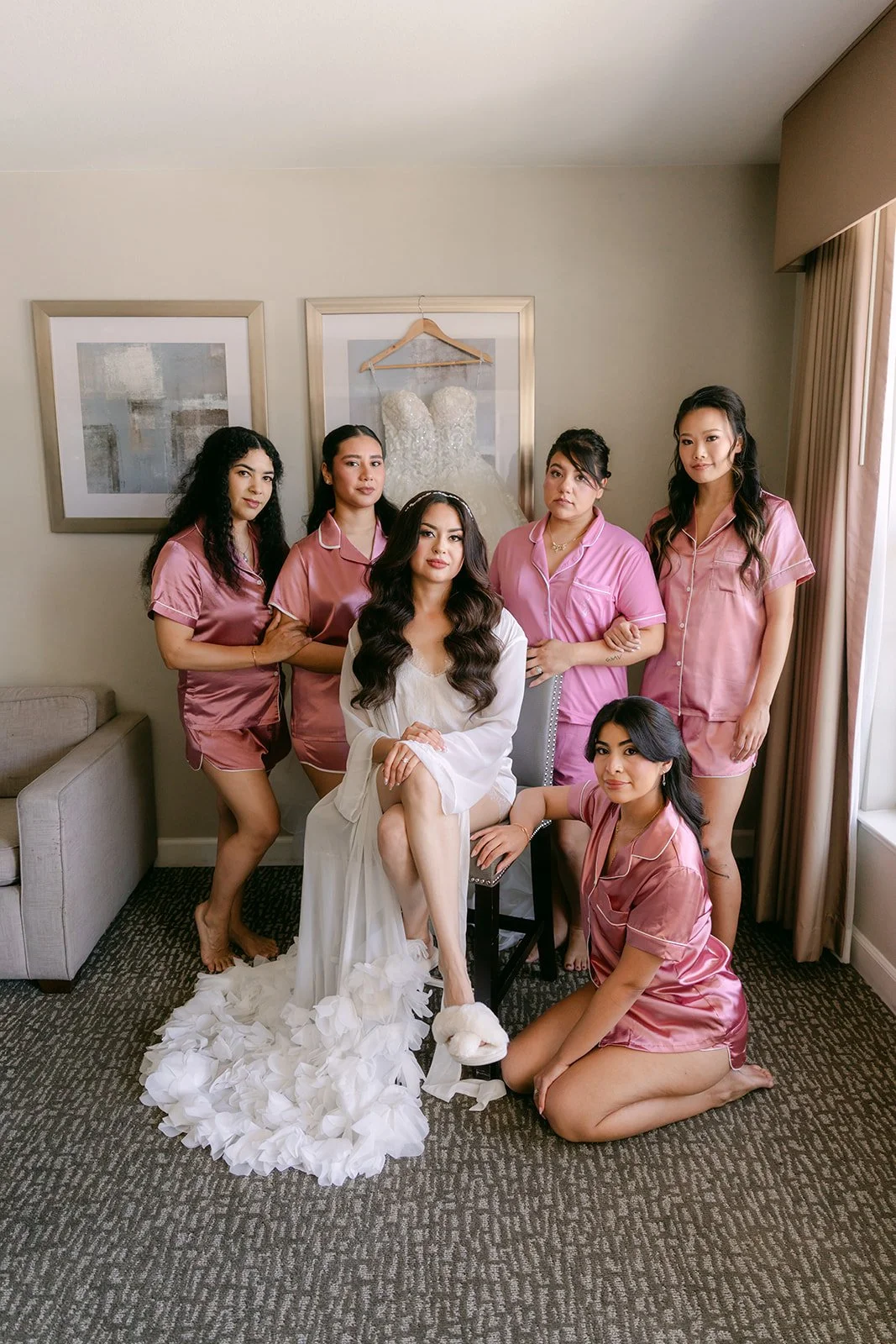 Sandra and her bridesmaids in dusty pink robes.