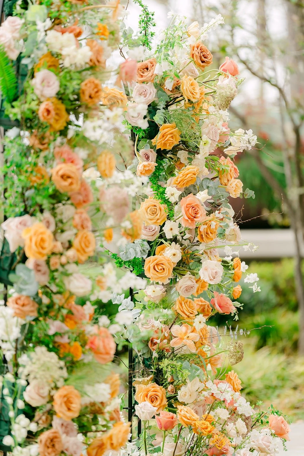Close up of the peach rose ceremony arch