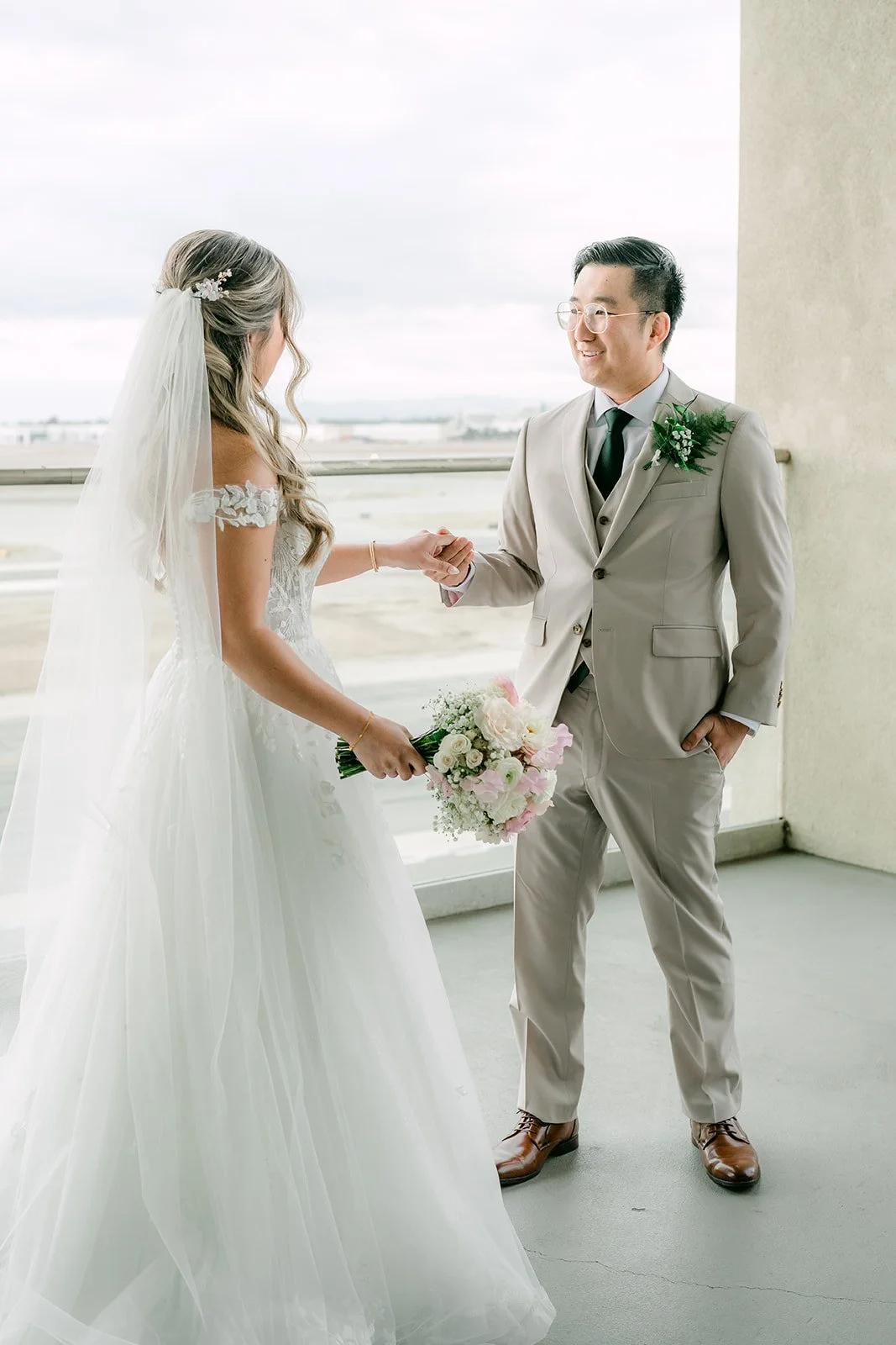 Raine and Ricky holding hands during their first look