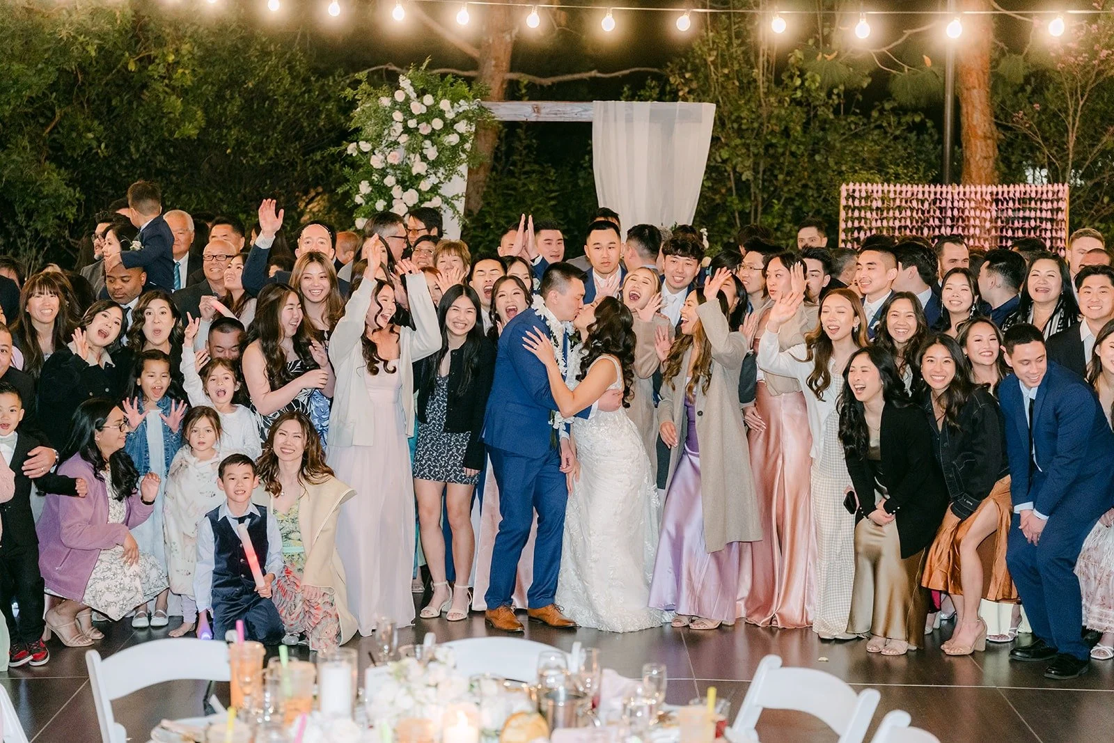 All of Kelli and Alex's guests gathered on the dance floor for one big group photo