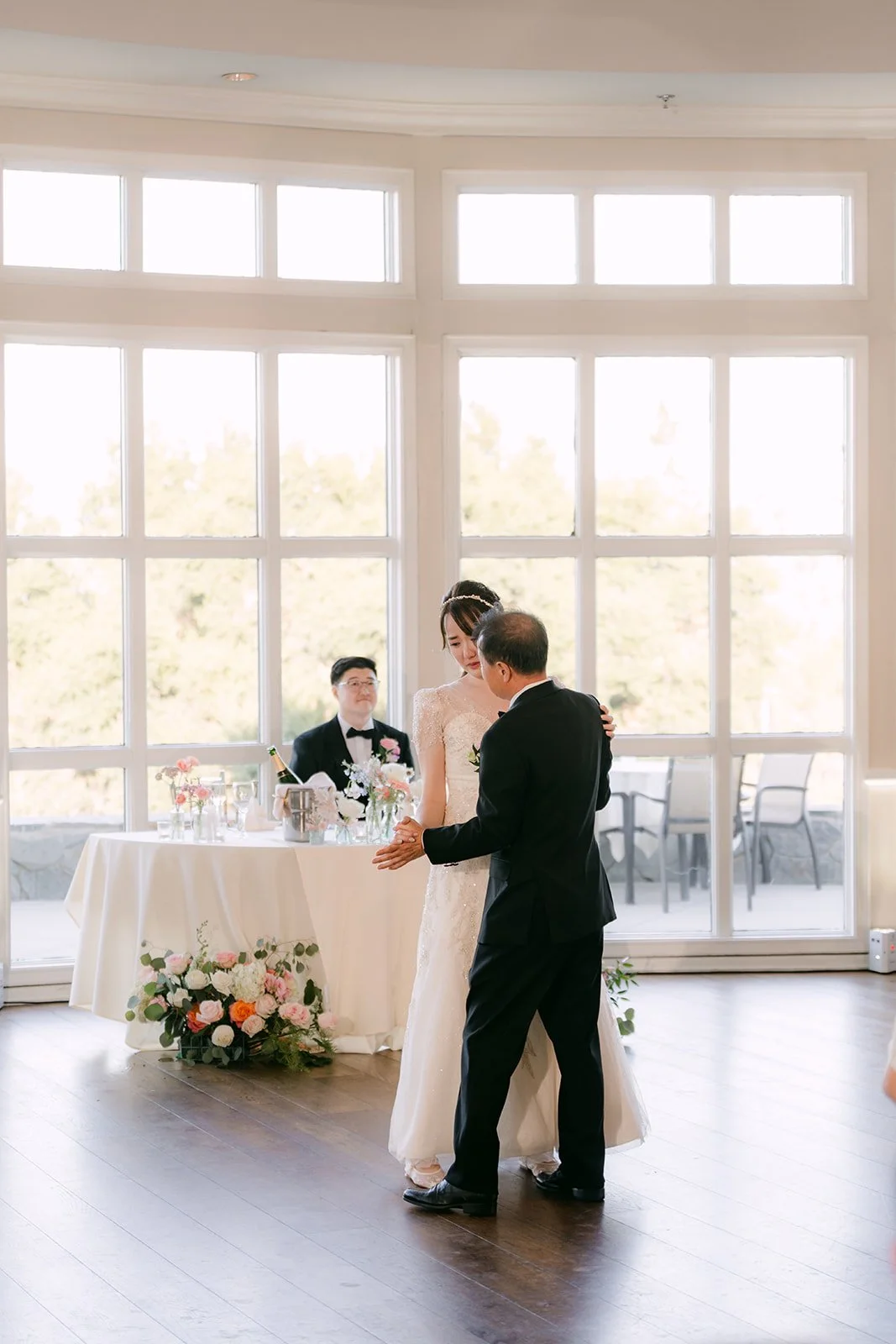 Judy and Joshua dancing by the windows