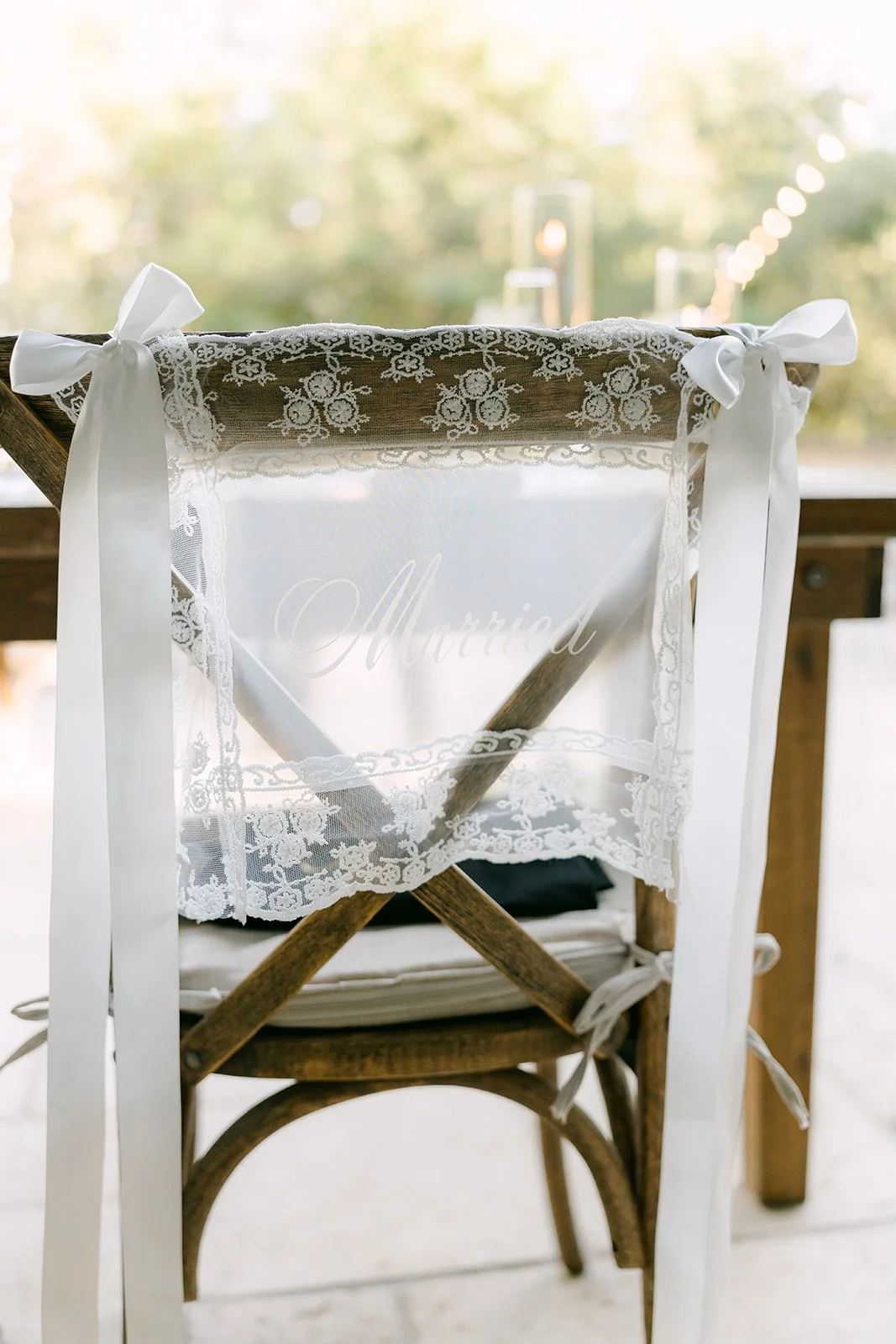 Sweetheart chairs for Nicole and Caryl draped in sheer fabric.