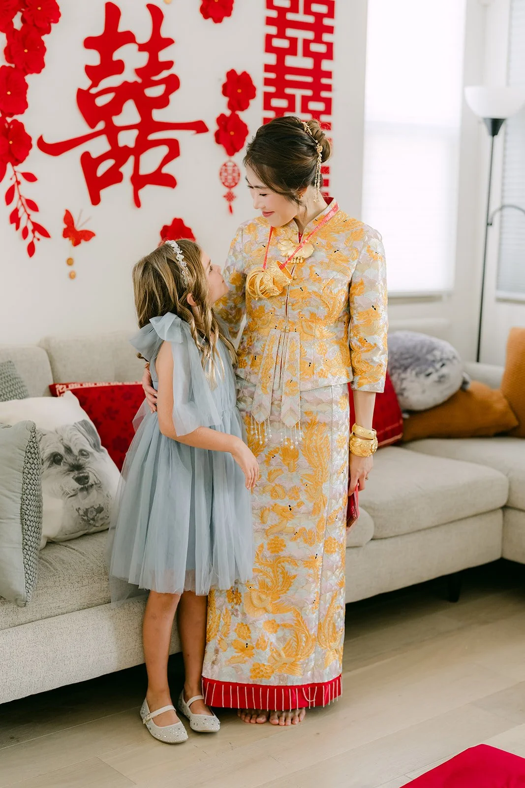 Christie smiles beside a young niece before the second tea ceremony.