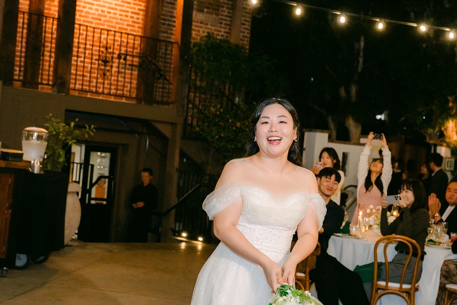 Chorok getting ready to toss her bouquet