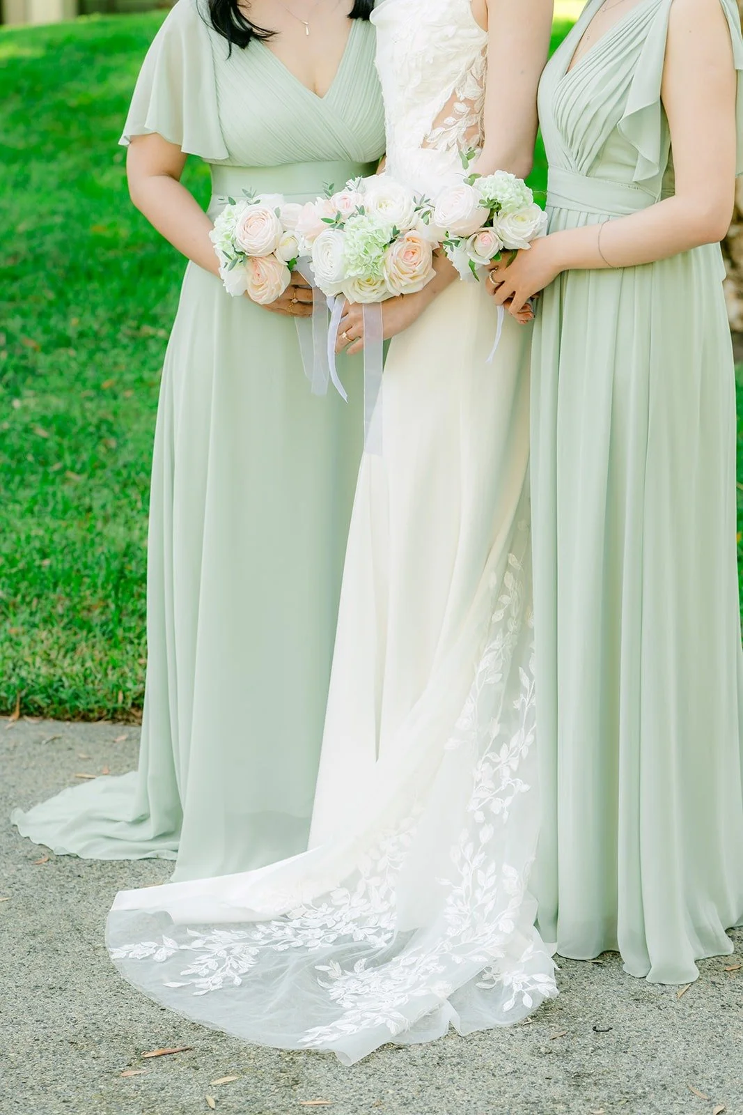 Tin and her bridesmaids in sage green on the lawn