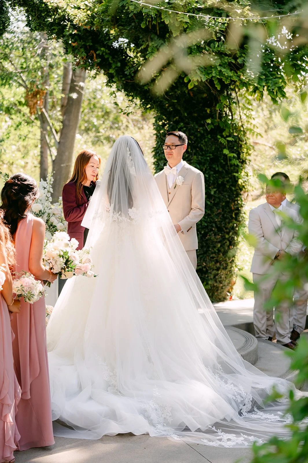 Sandra's long veil spilling across the aisle during the ceremony.