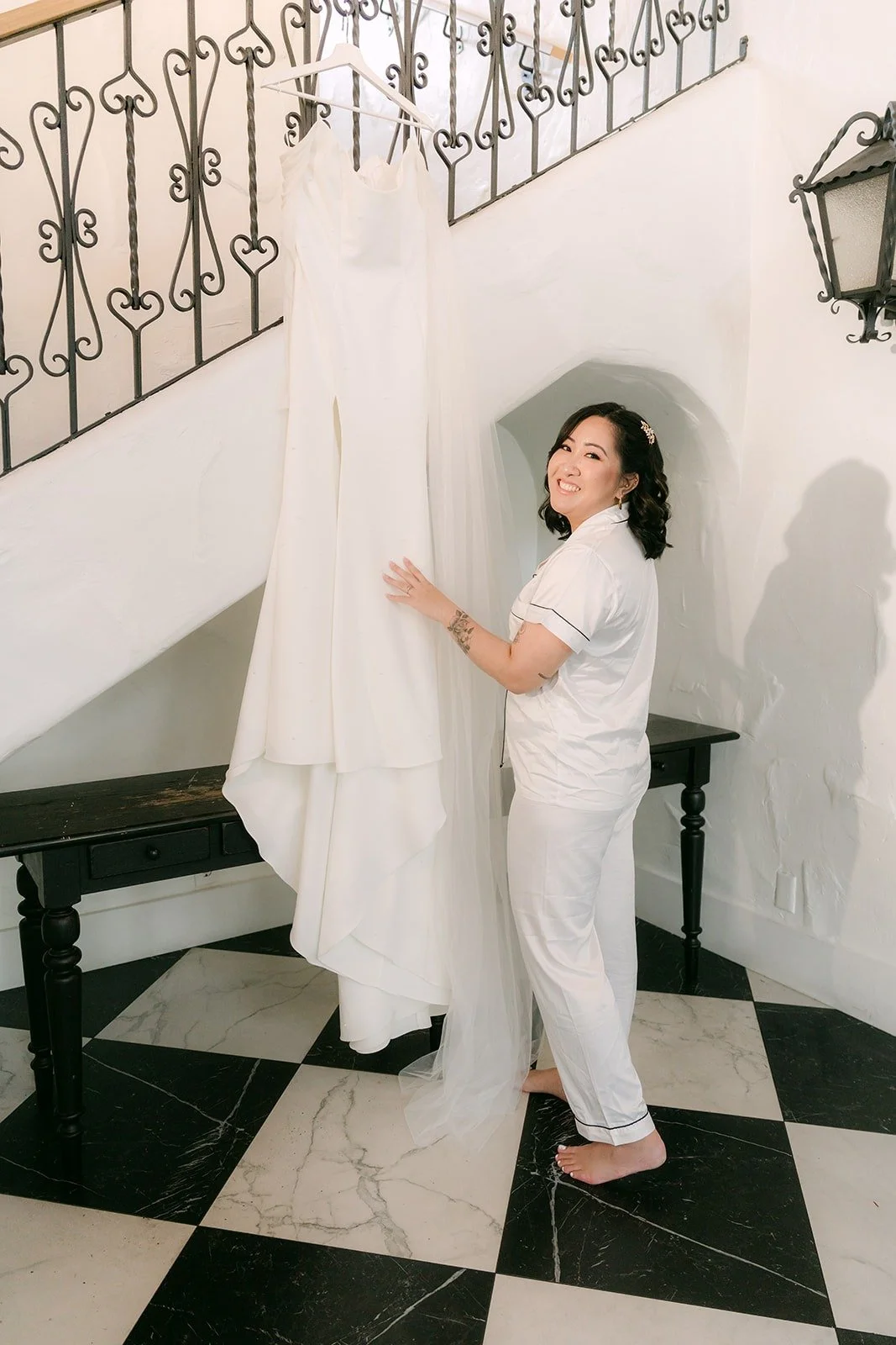 Vivian in white pajamas beside her gown at The Villa in Westminster
