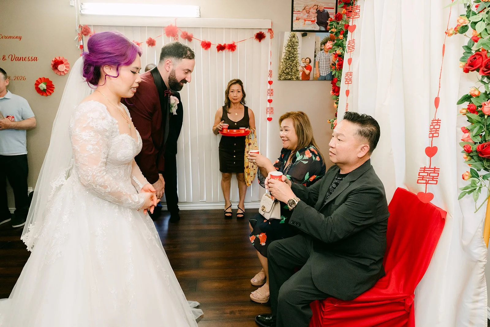 Vanessa and Ryan offering tea to an uncle.