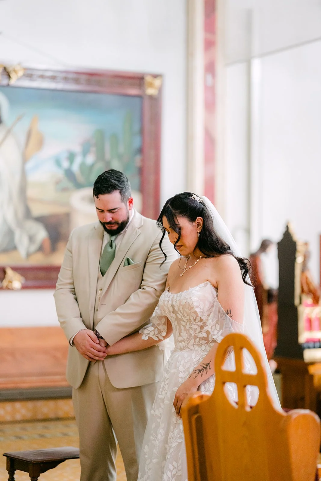 Fernanda and Cody standing together at the altar.