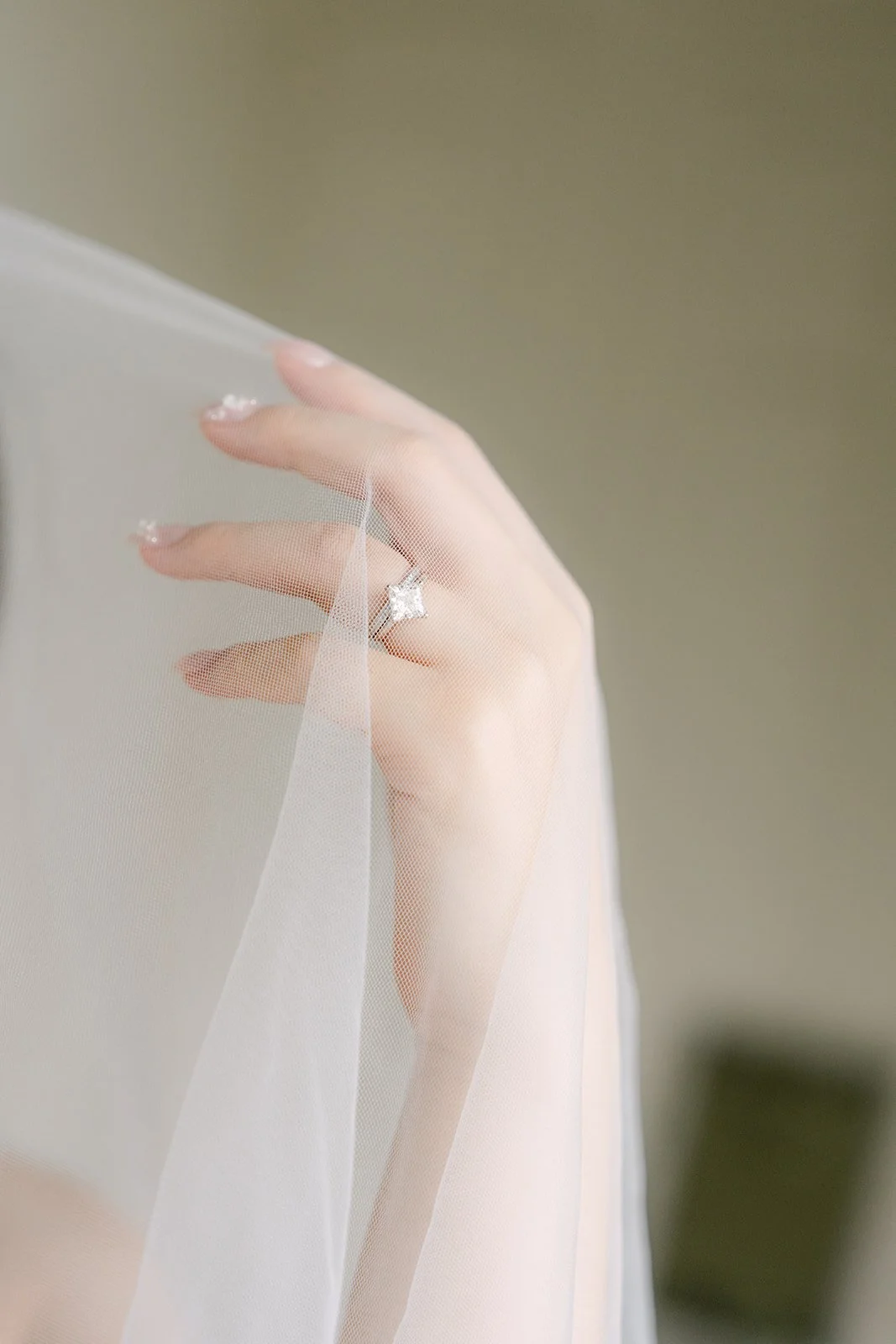 Mary's engagement ring under her veil