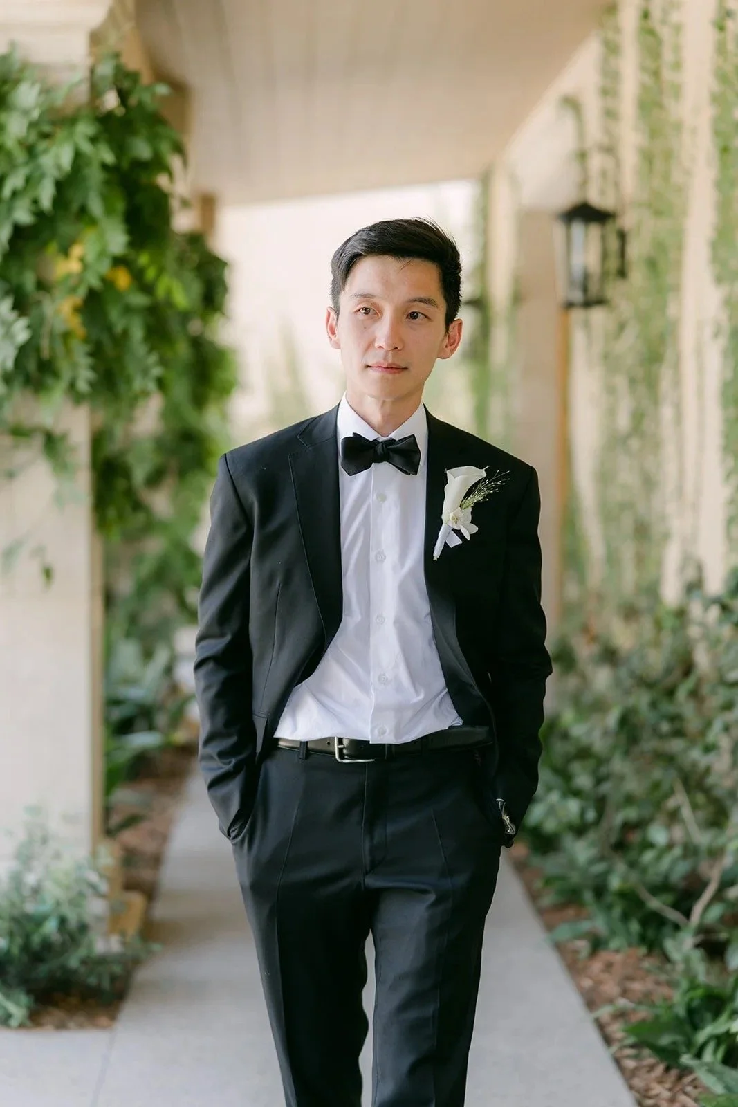 Groom portrait with a white calla lily boutonniere at Monte Bella