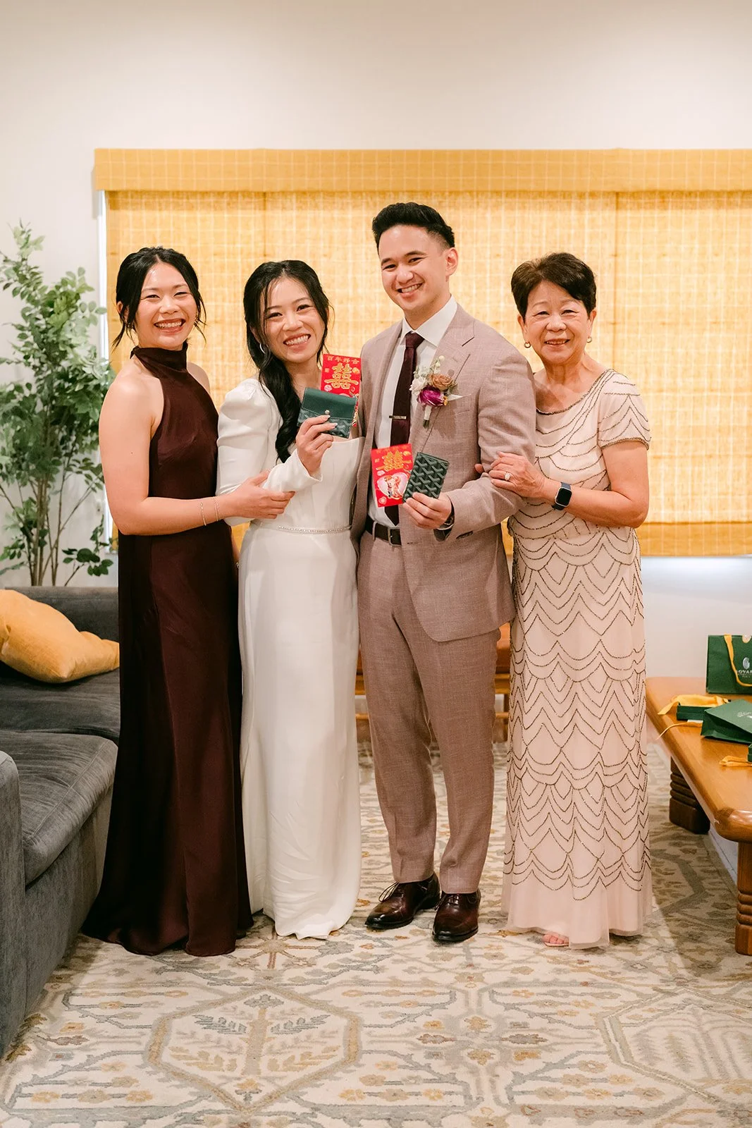 Denise and Michael with her mom and sister after the tea ceremony, photographed by One and Only Production.
