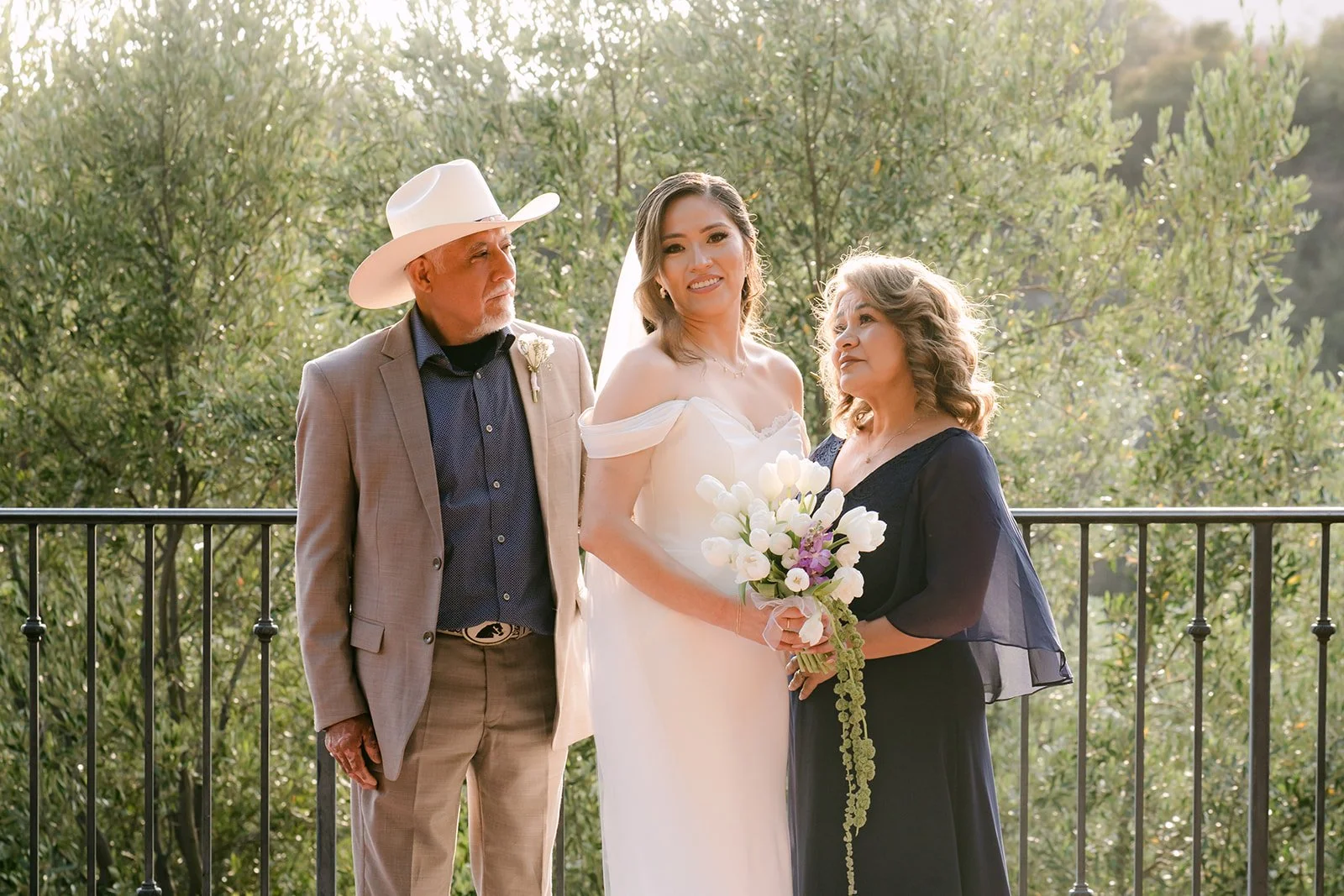 Mariana with her parents on the sunset terrace