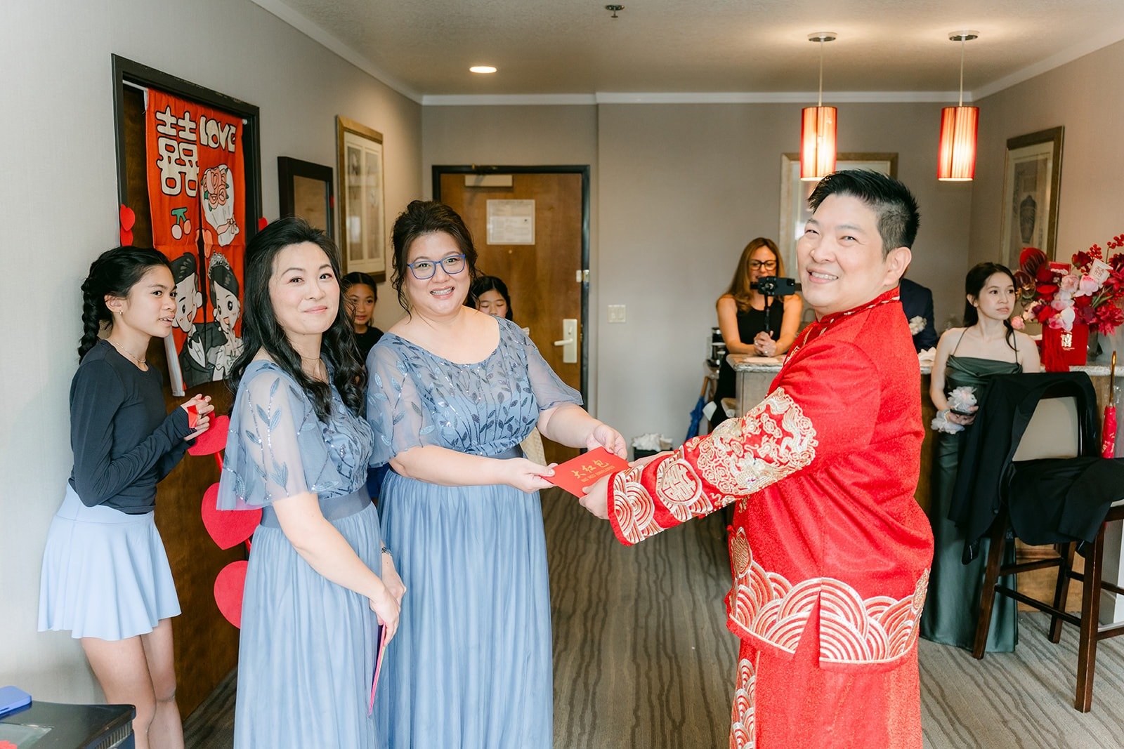 Jay meets the bridesmaids in the hotel suite at the DoubleTree Claremont