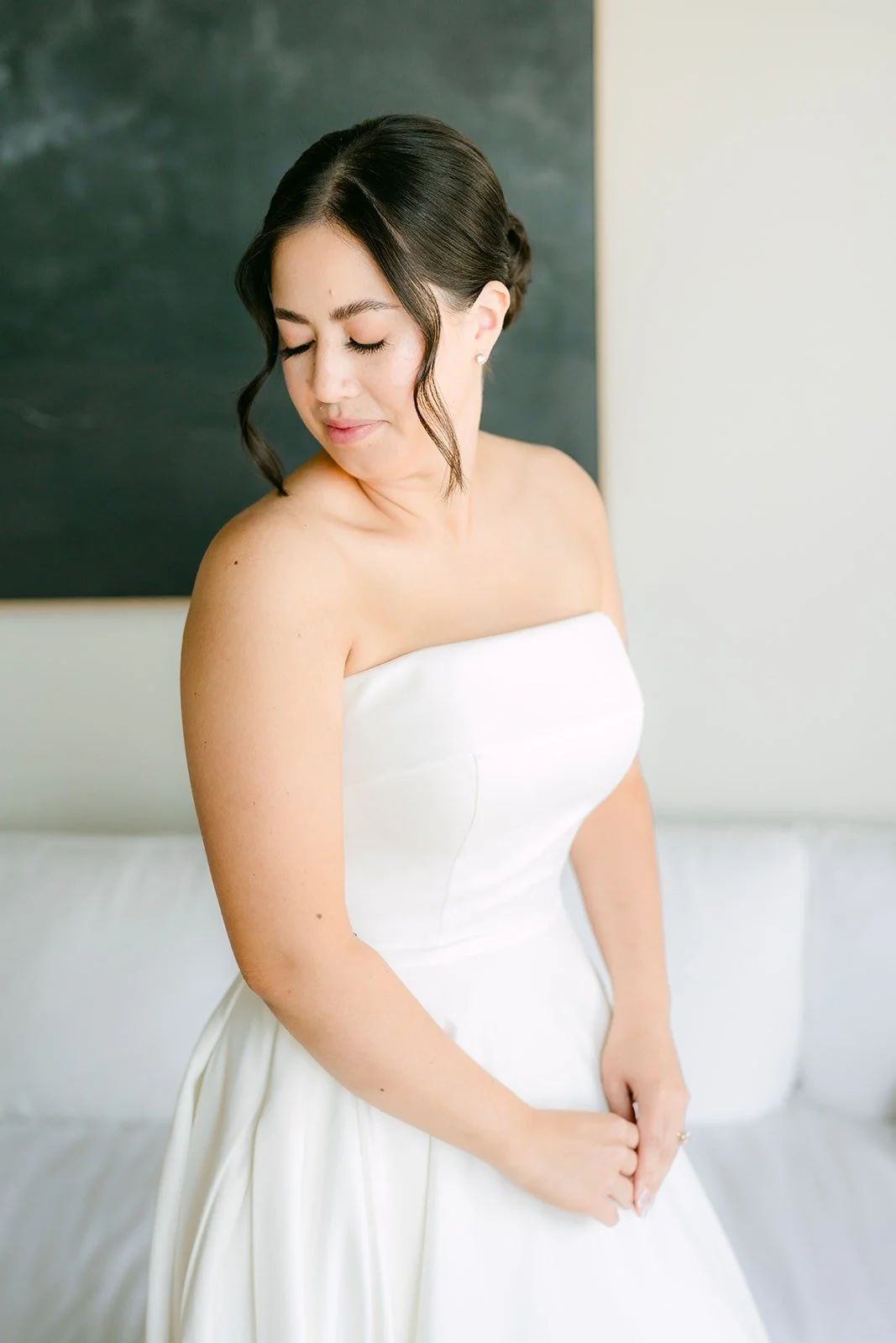 Brianna in her gown in the hotel suite