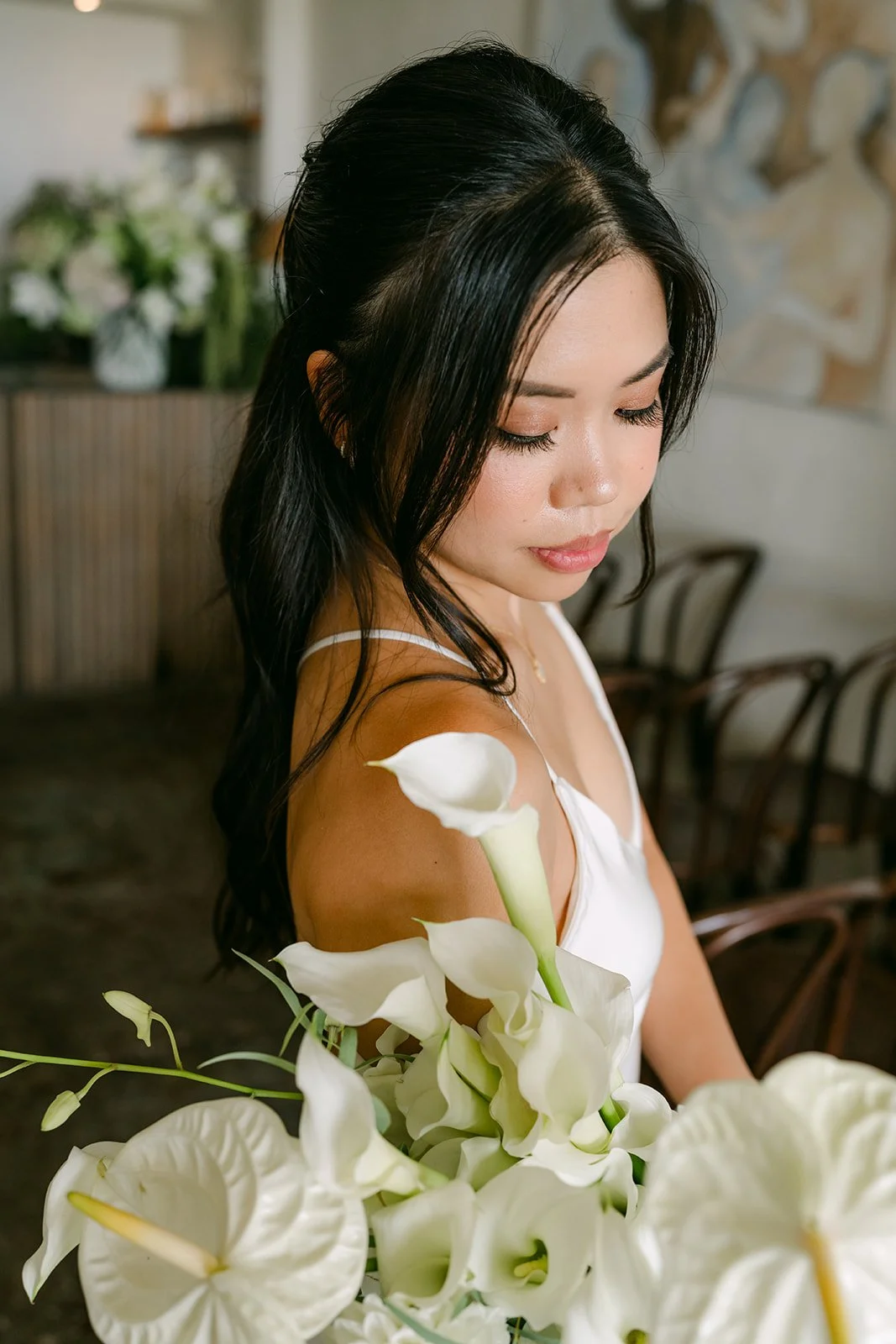 A close portrait of Justine with her florals