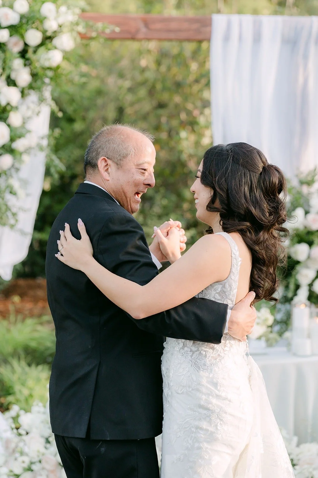 Kelli dancing with her dad on the reception lawn