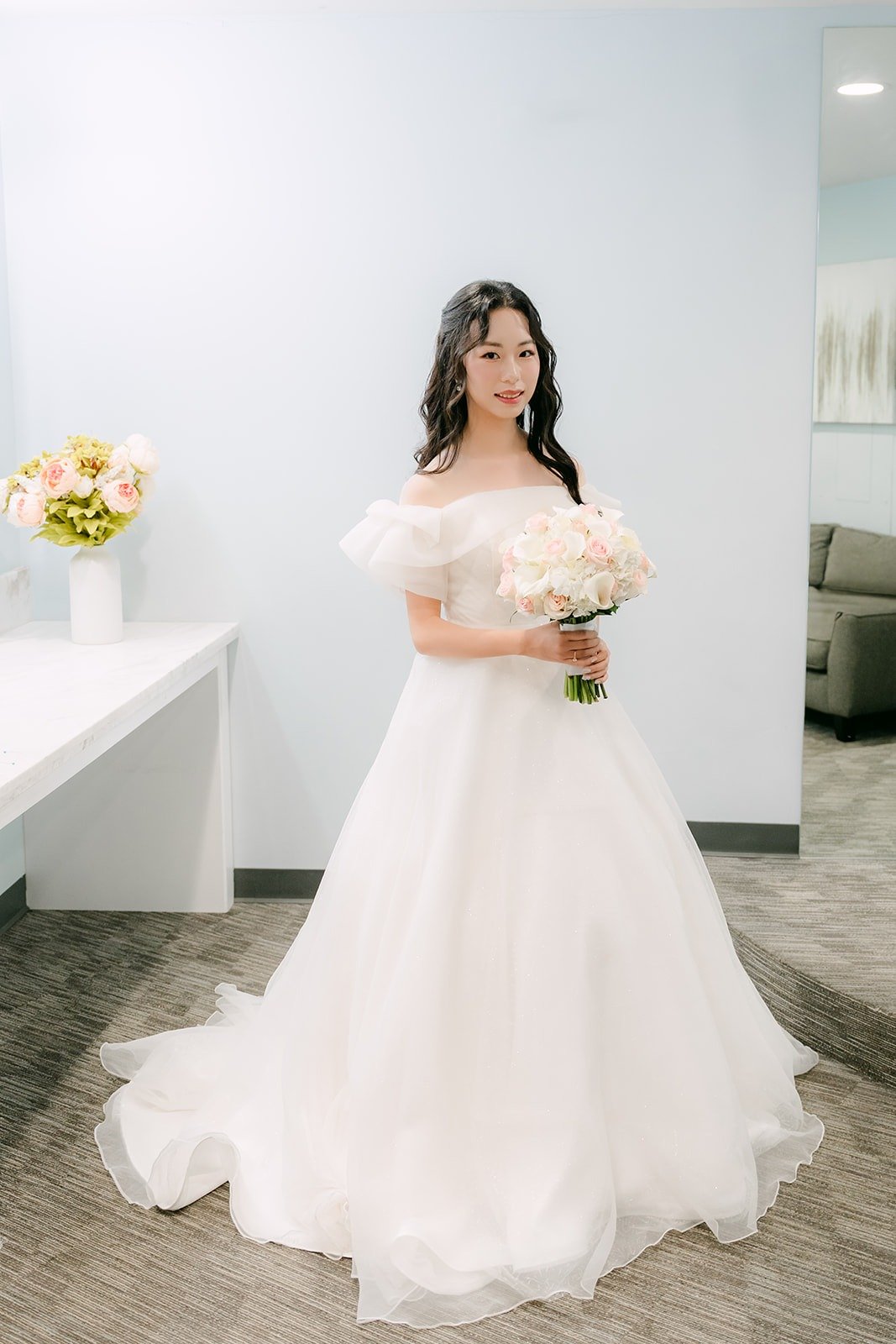 Jeannie in her off the shoulder ballgown in the bridal suite