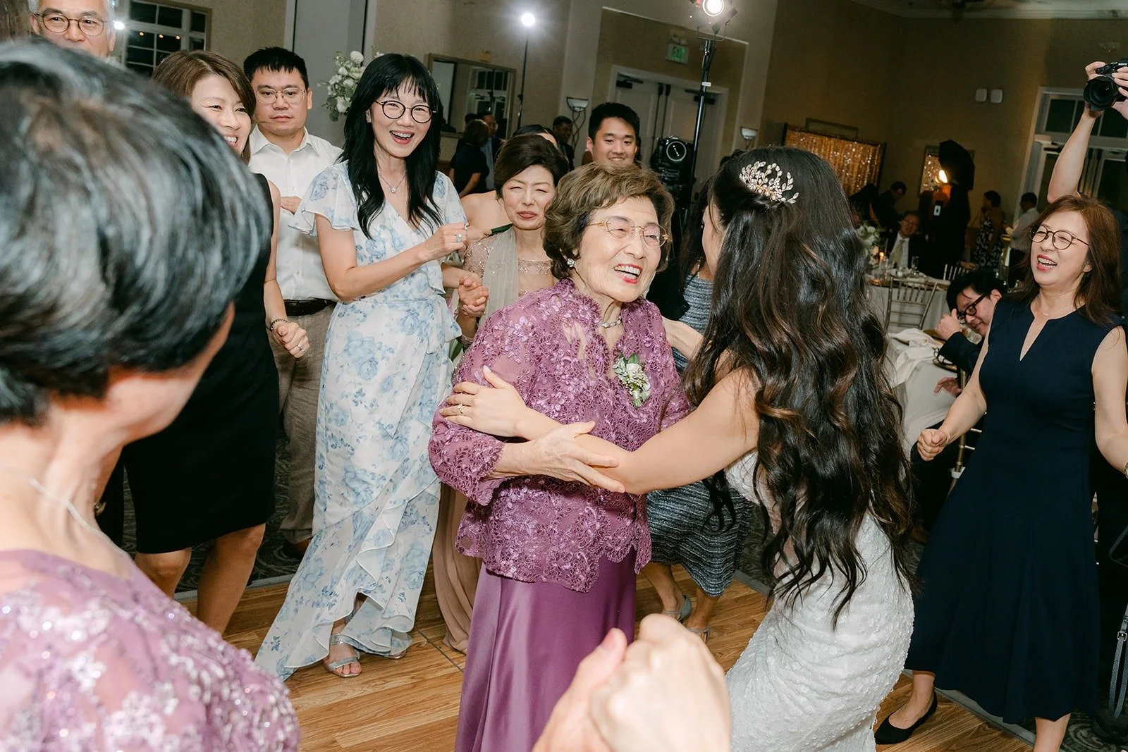 A crowded dance floor with Kristine in the middle