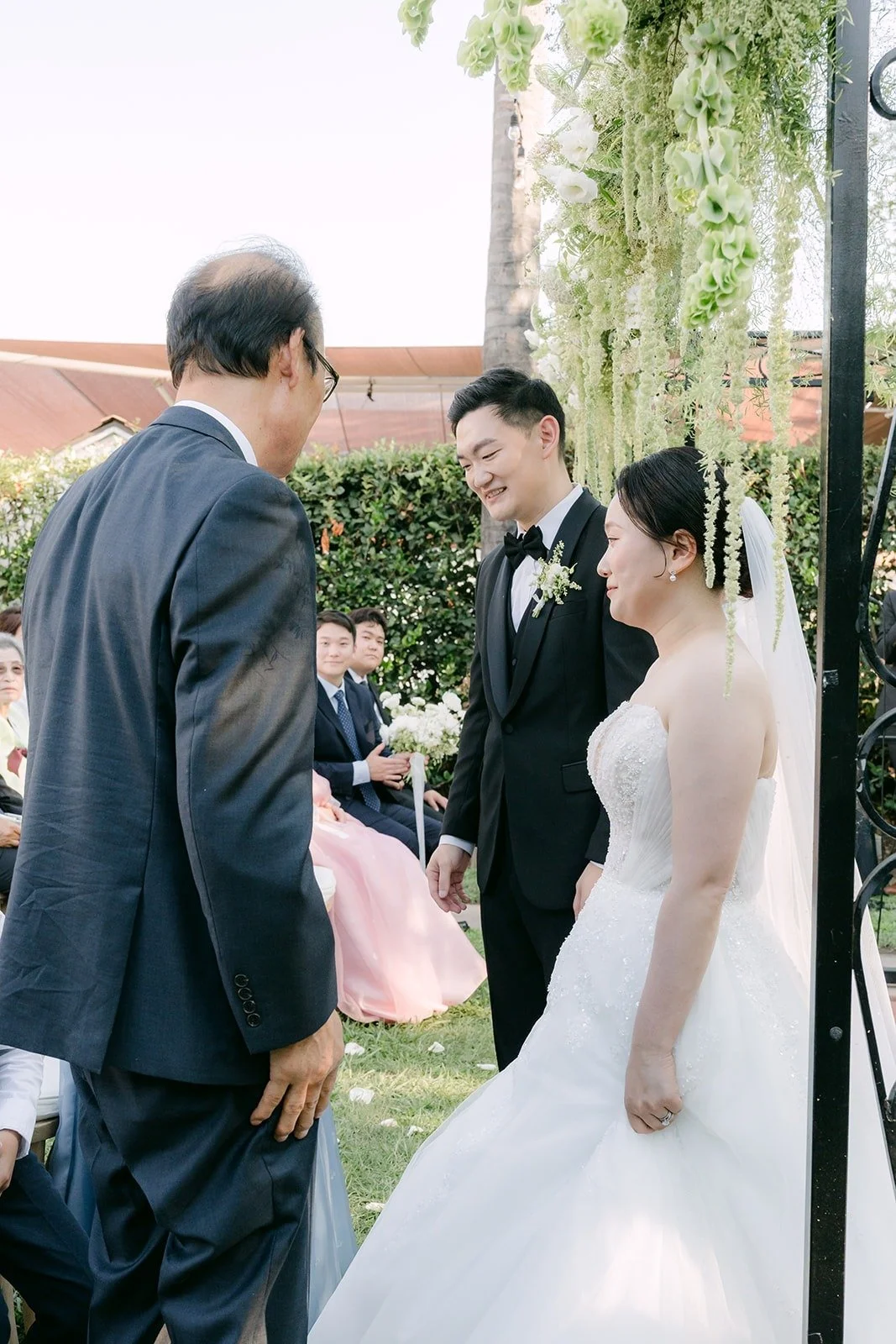Amy being handed off to Sam at the front of the aisle