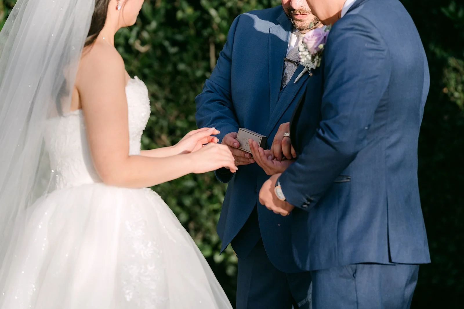 Kate and Michael holding hands during their vows.