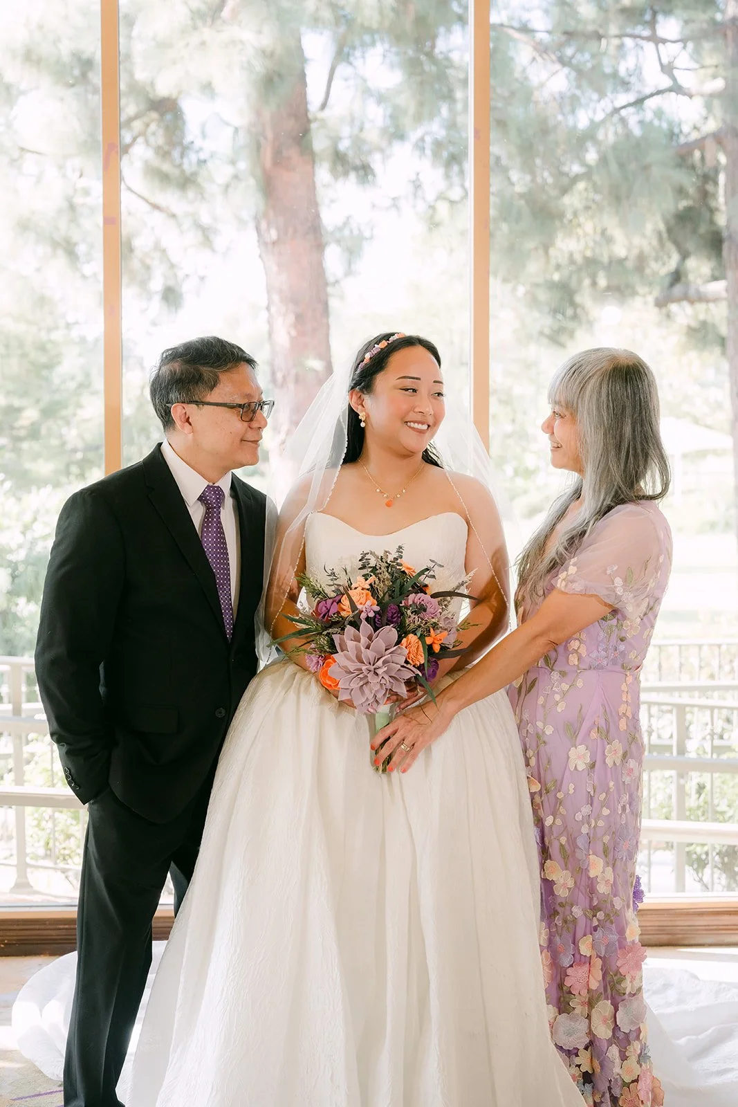 Angela laughing with her parents