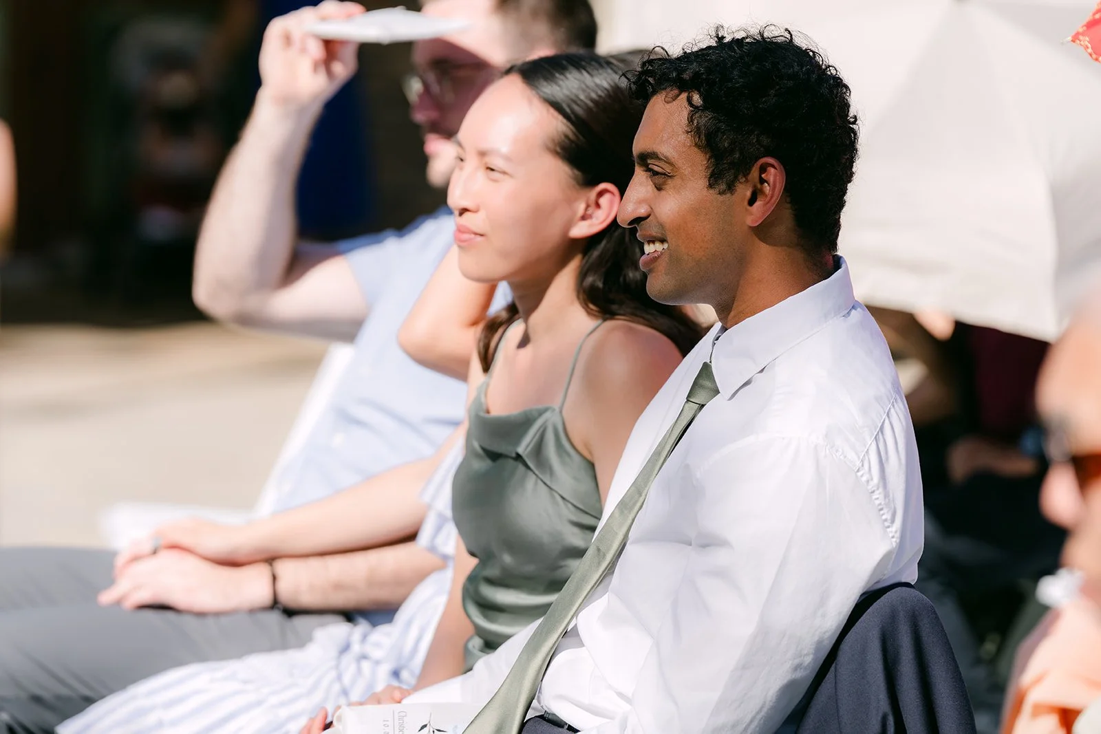 Guests laughing during Christie and Christian's vows.