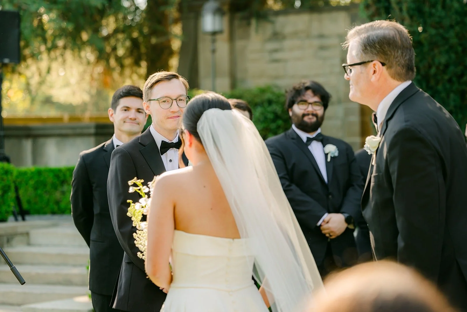 Brianna and Nik holding hands at the front of the ceremony