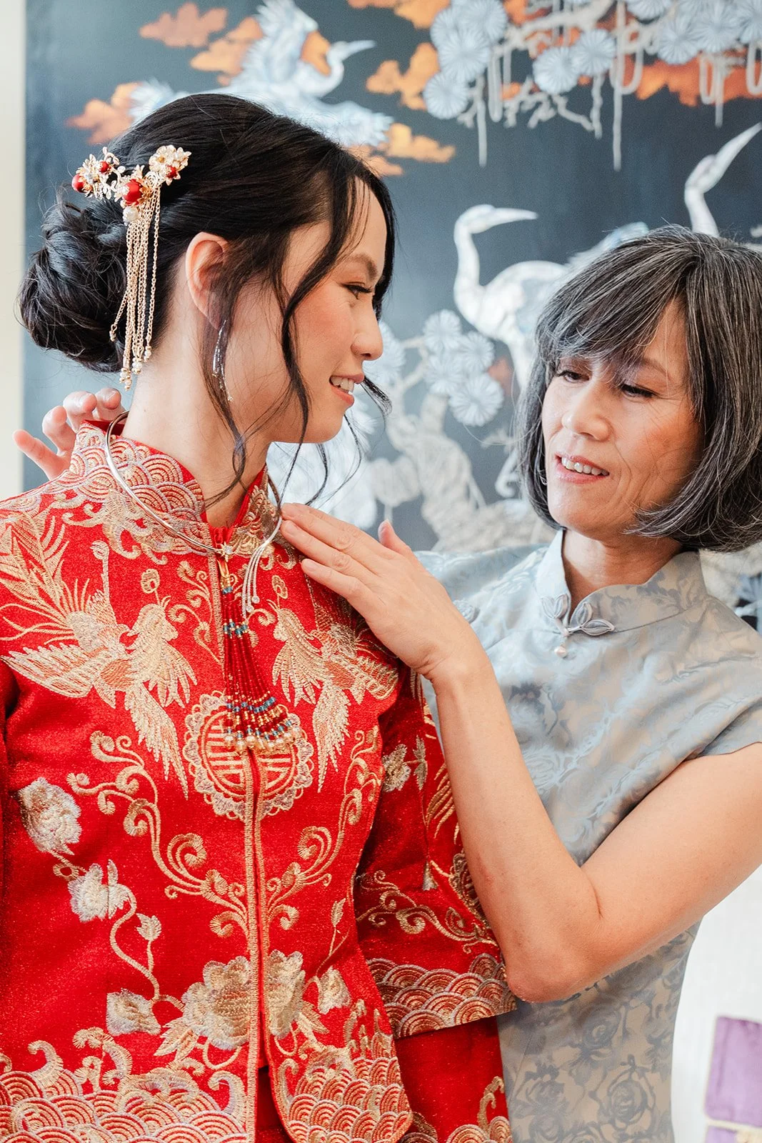 A relative adjusting Bridgette's jewelry.