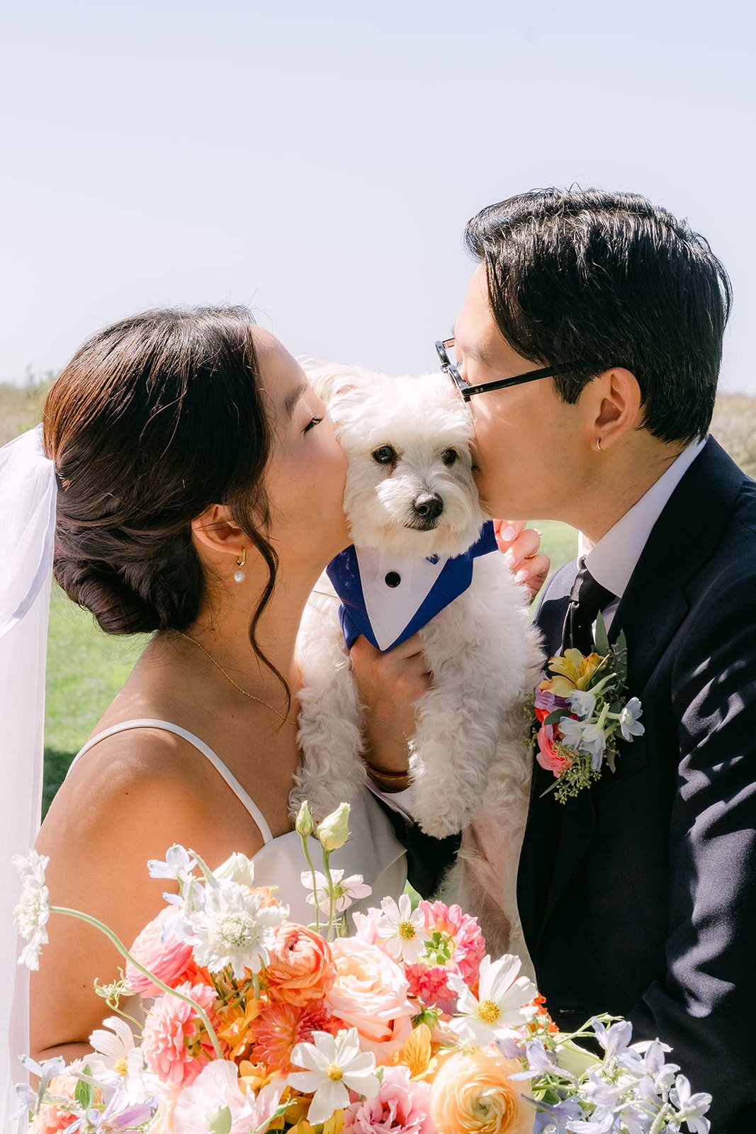 A kiss over the dog's head