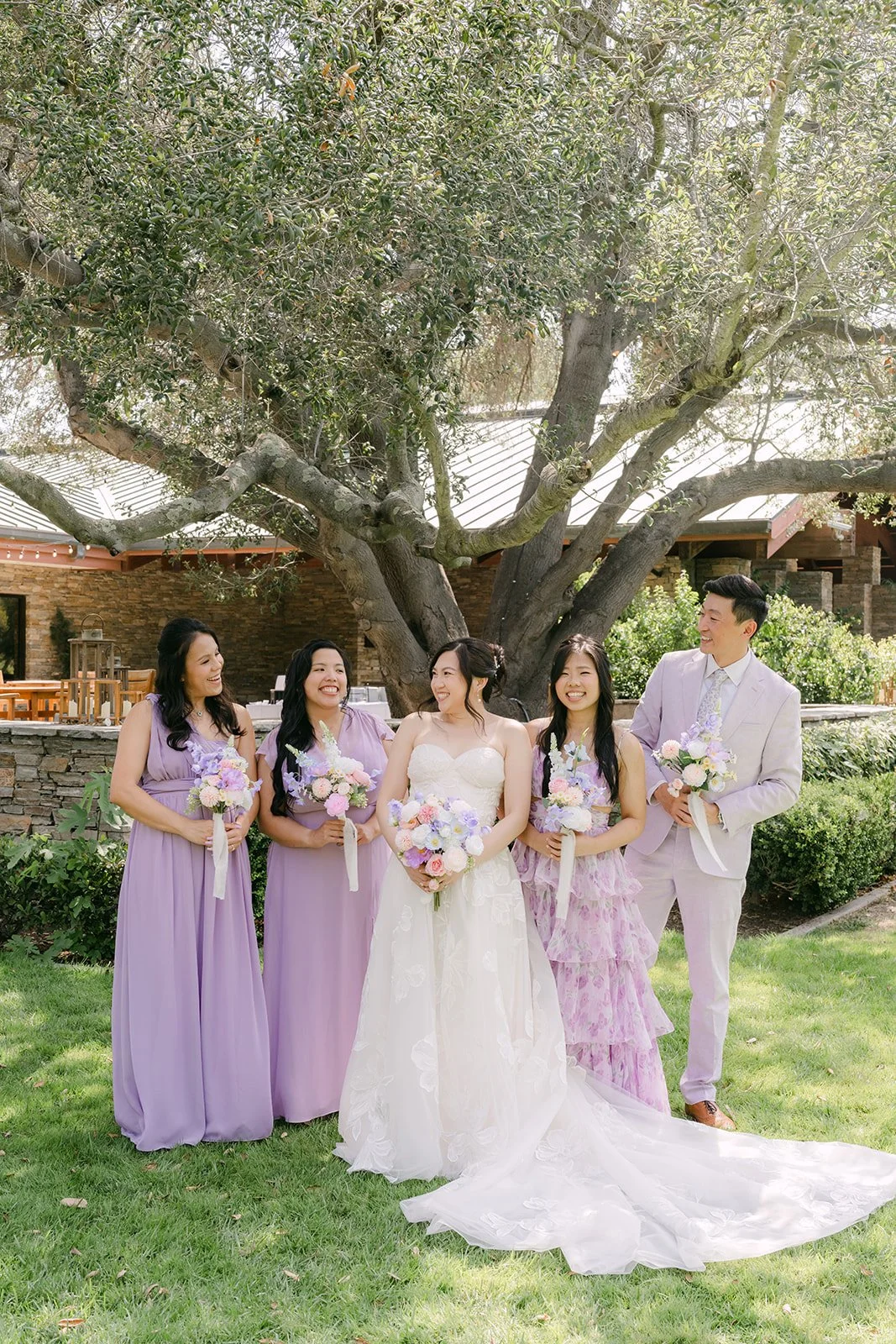 Mary with her bridesmaids in lavender under the oak tree