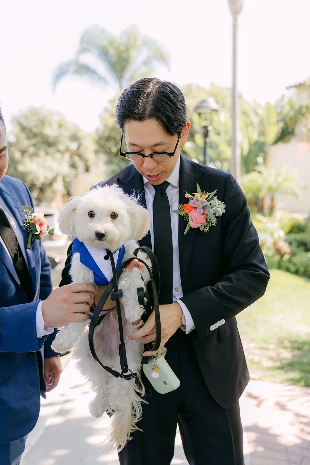 Leroy clipping on the pup's leash