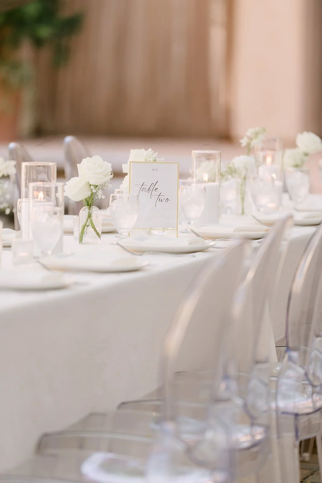 Close up of ivory place settings and glassware