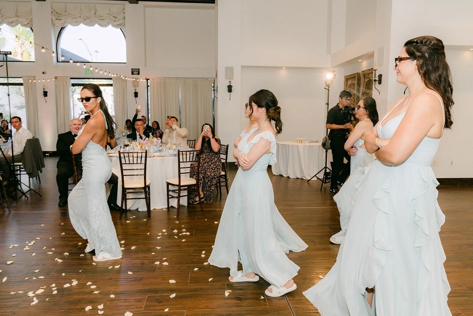Bridesmaids twirling during the grand entrance
