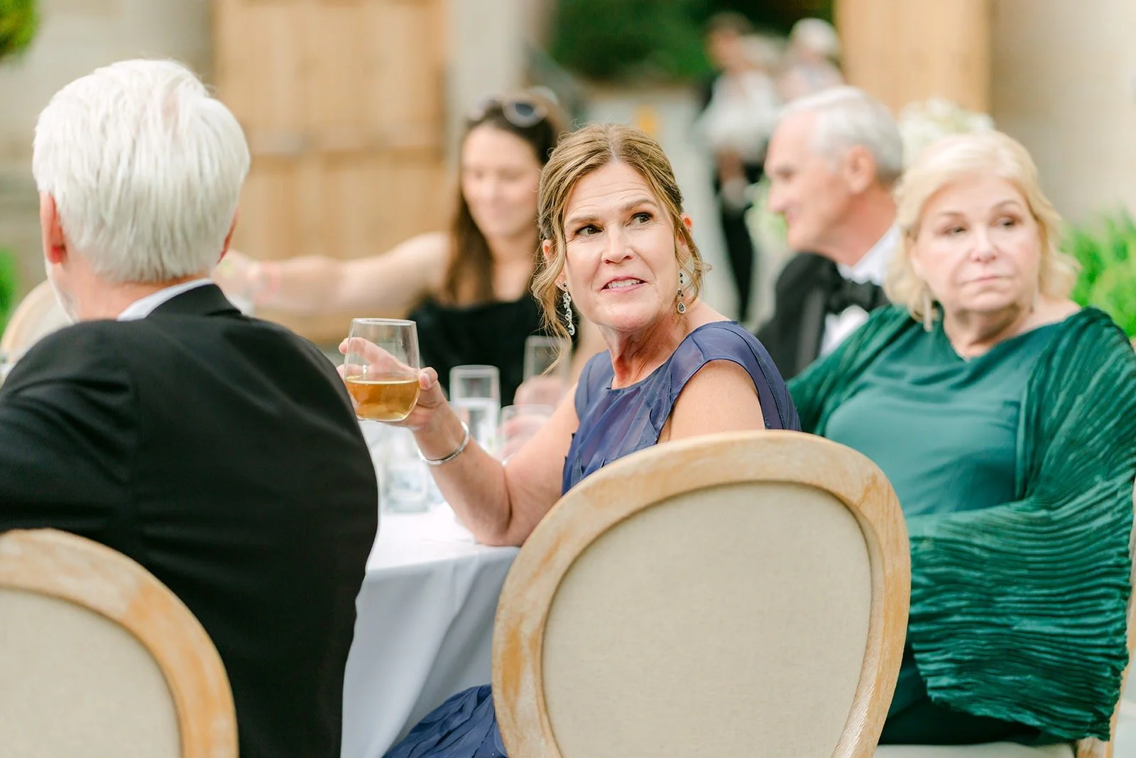Guests laughing during the toasts