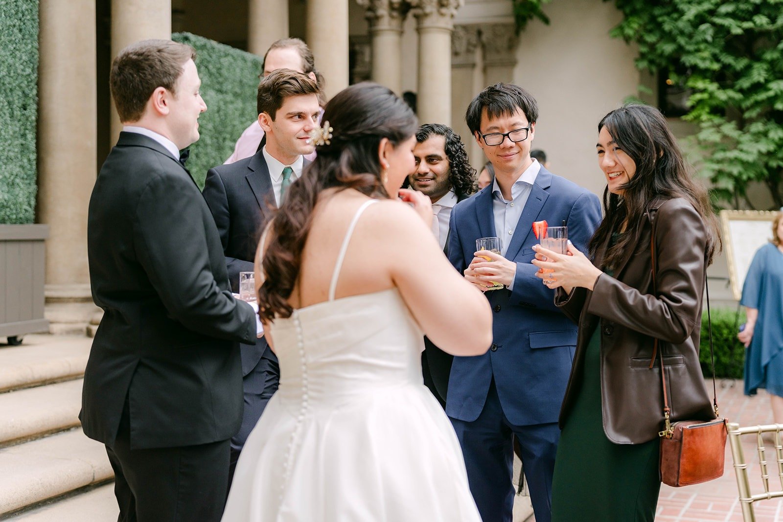Saira and Matthew chatting with friends on the patio