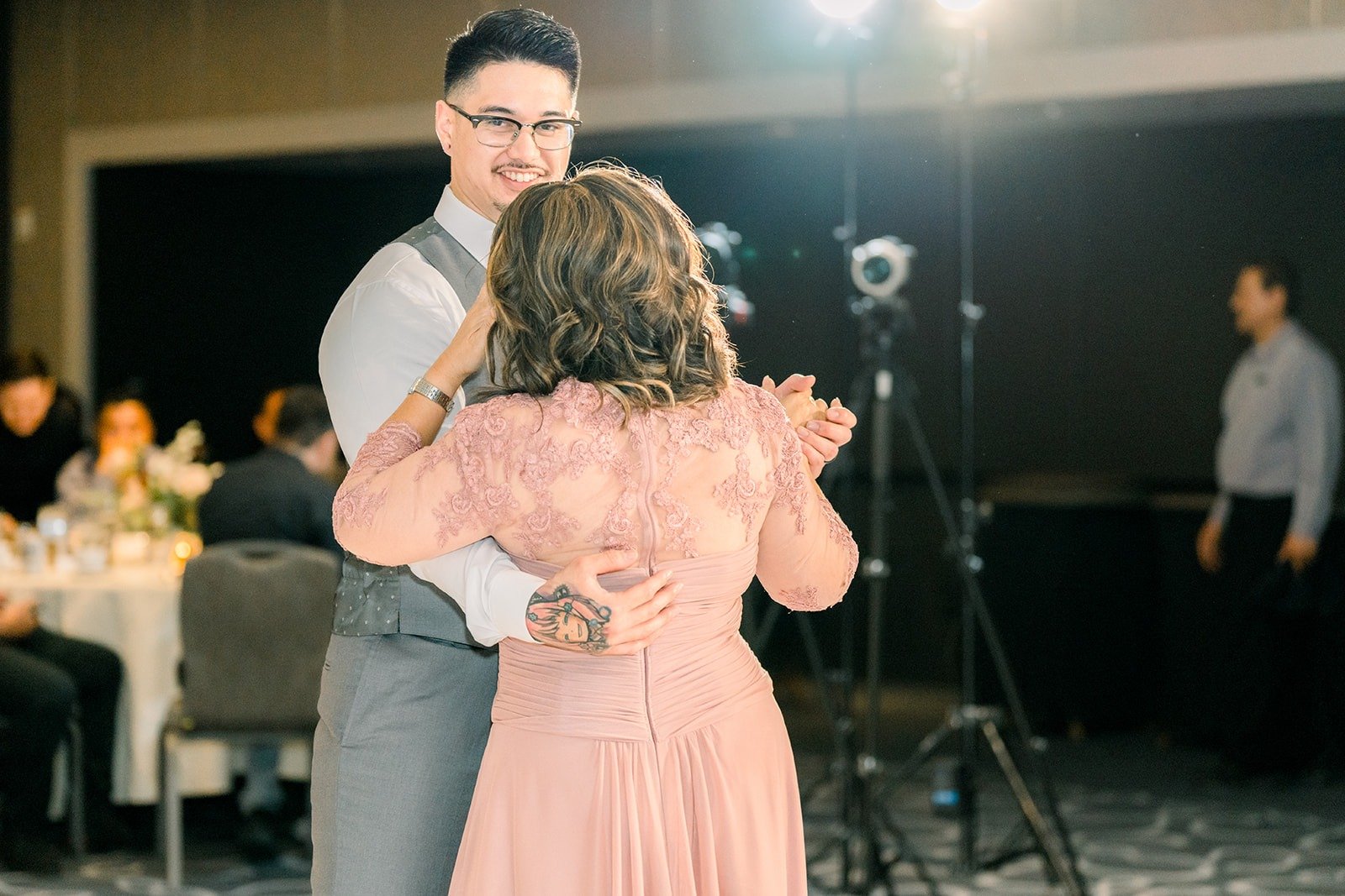 Mikey dances with a family member during the parent dances