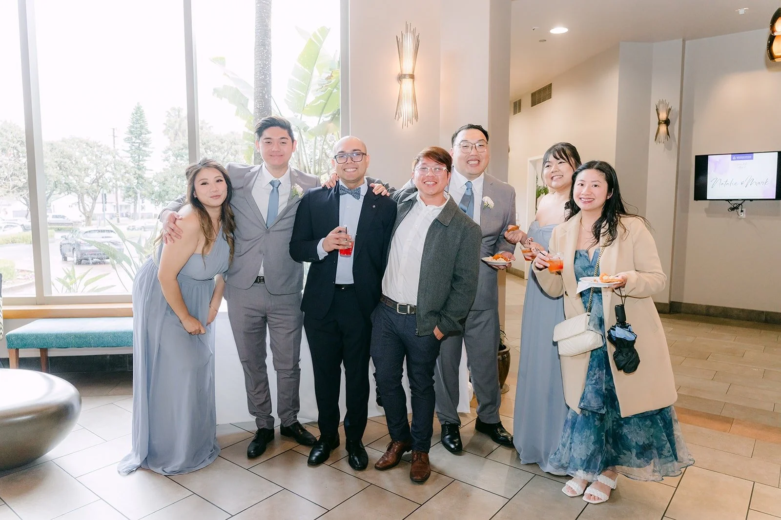 Natalie and Mark posing with friends inside the venue