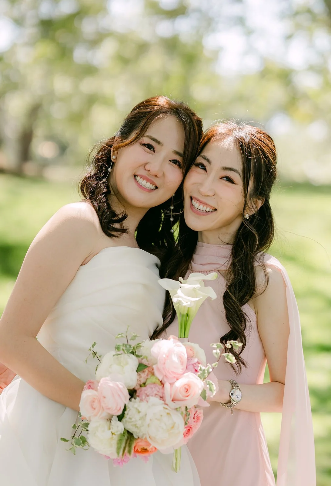 Judy cheek to cheek with a bridesmaid