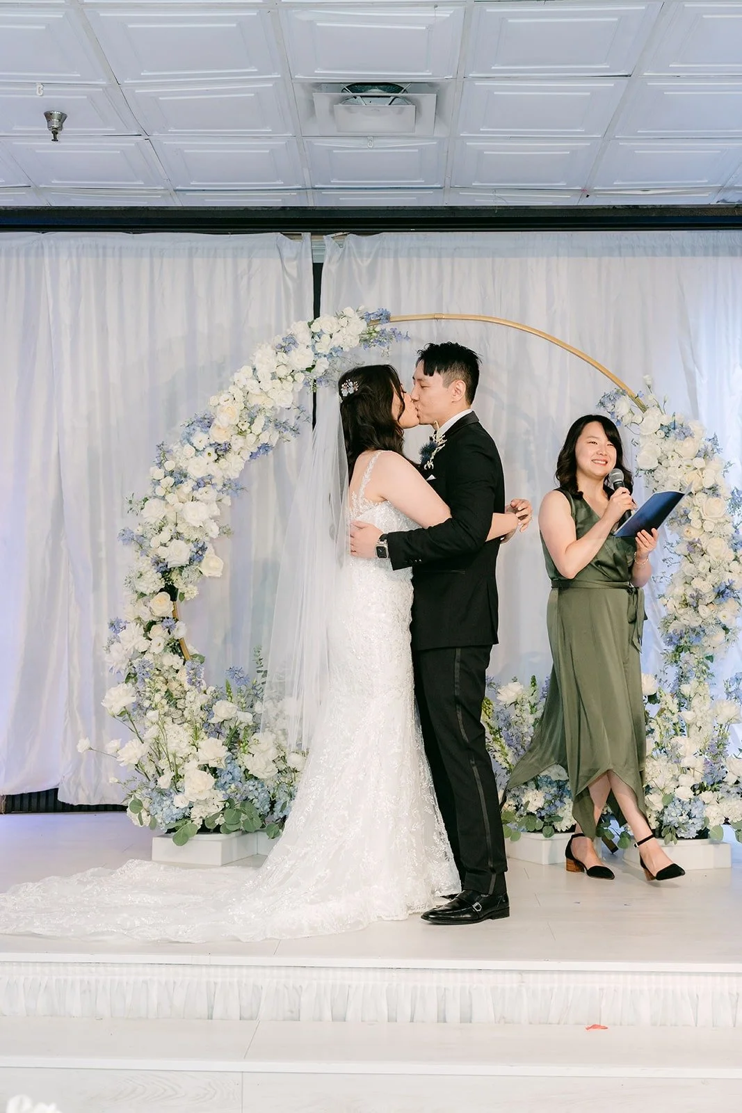 Emily and James sharing their first kiss as a married couple