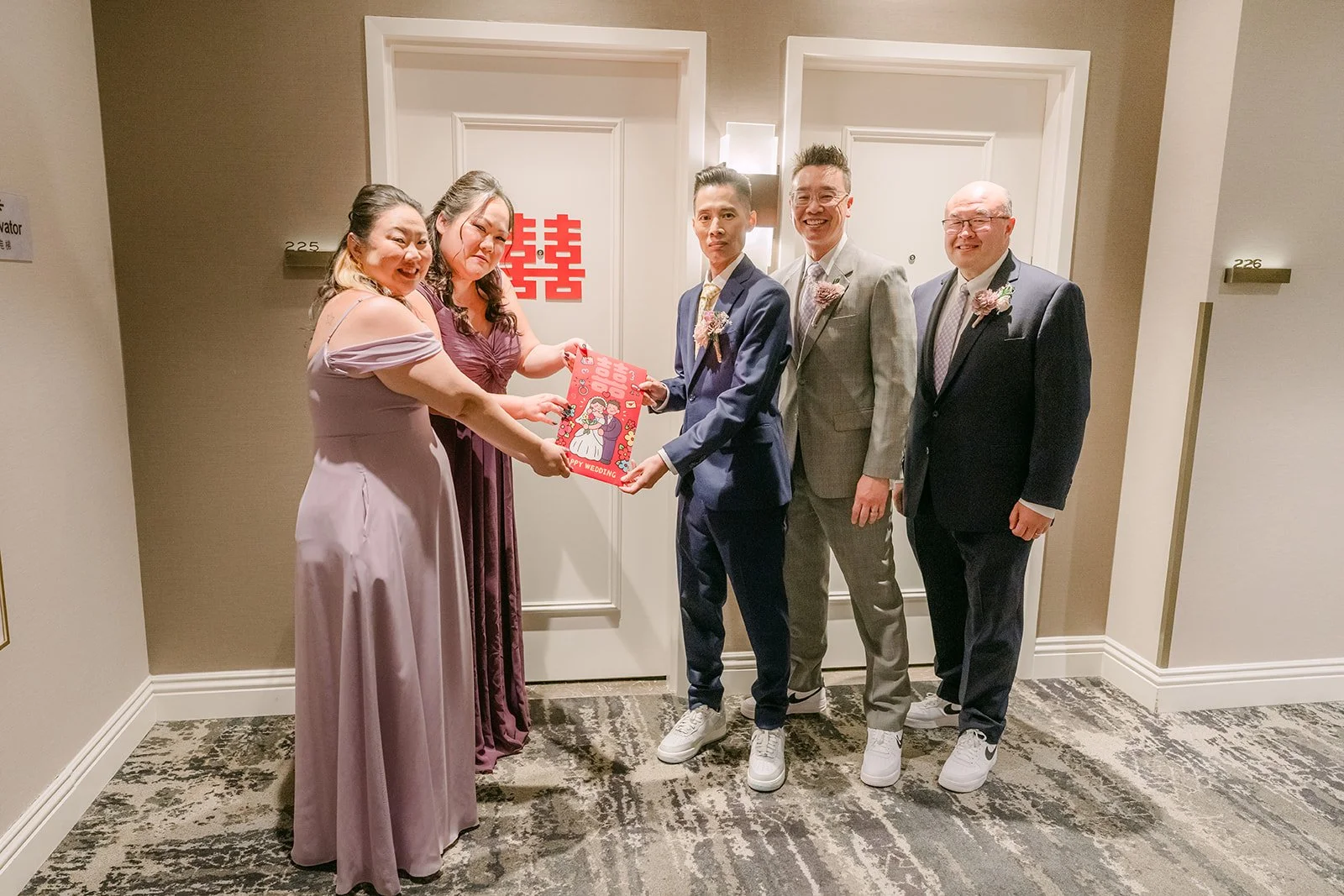 Bobby and his groomsmen facing the bridesmaids at the door.