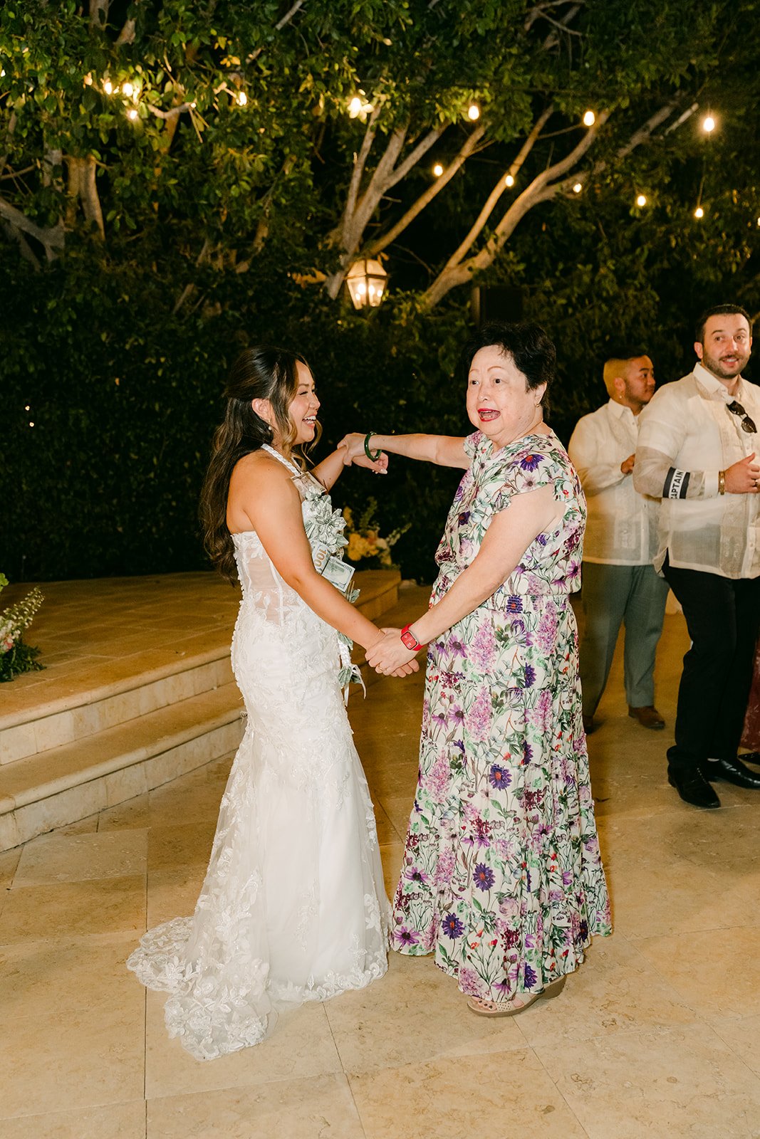 Nicole dancing with a guest during the money dance at Eden Gardens.