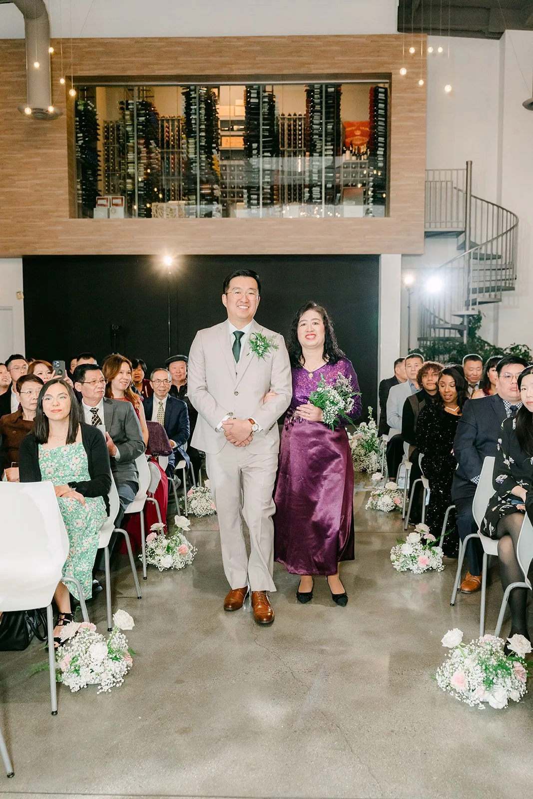 Ricky walking down the aisle with his mother at The Modern