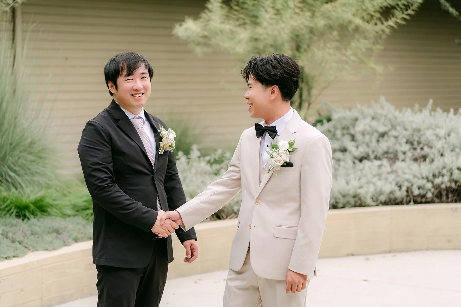 Wen and Henry shaking hands.
