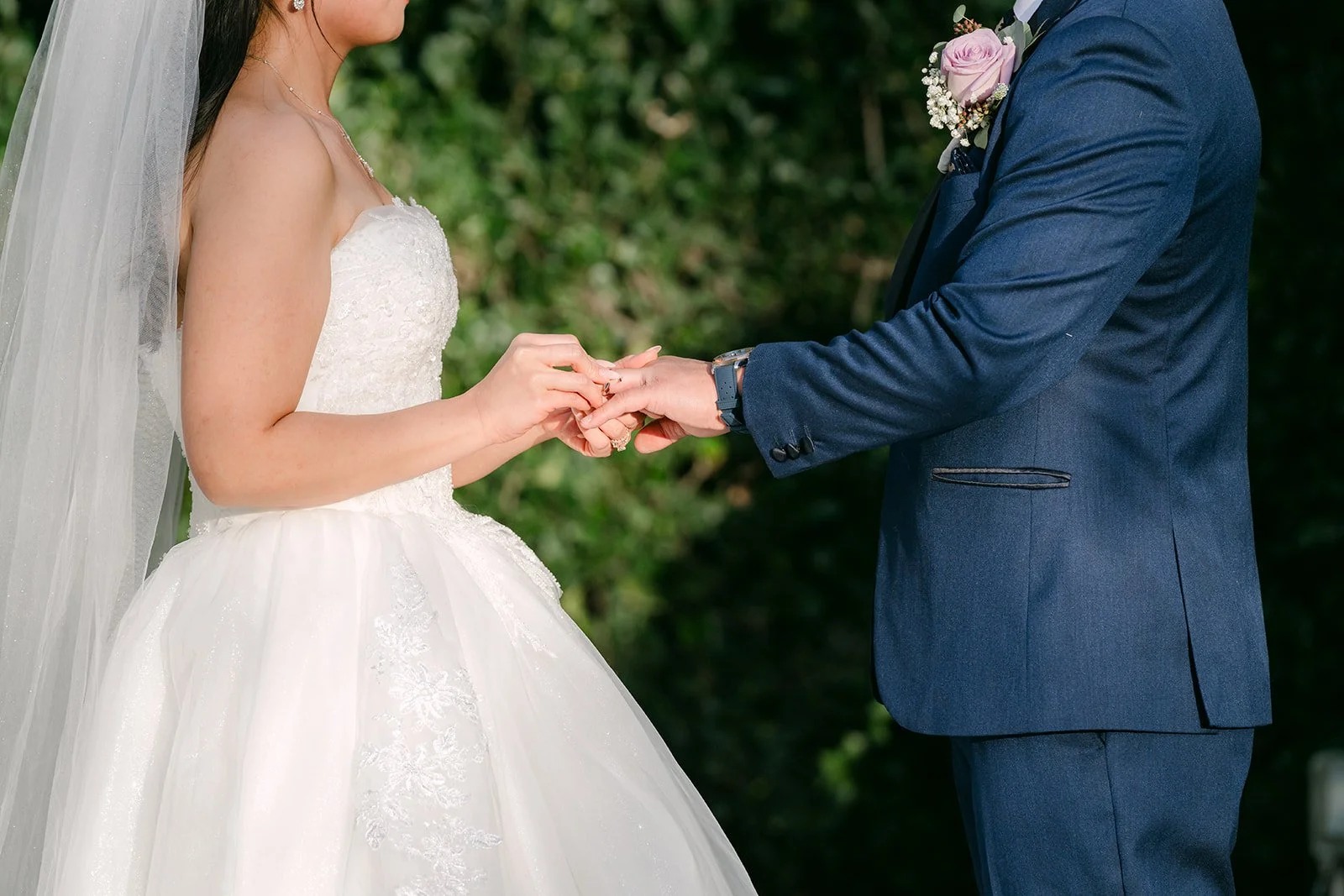Kate and Michael exchanging rings.