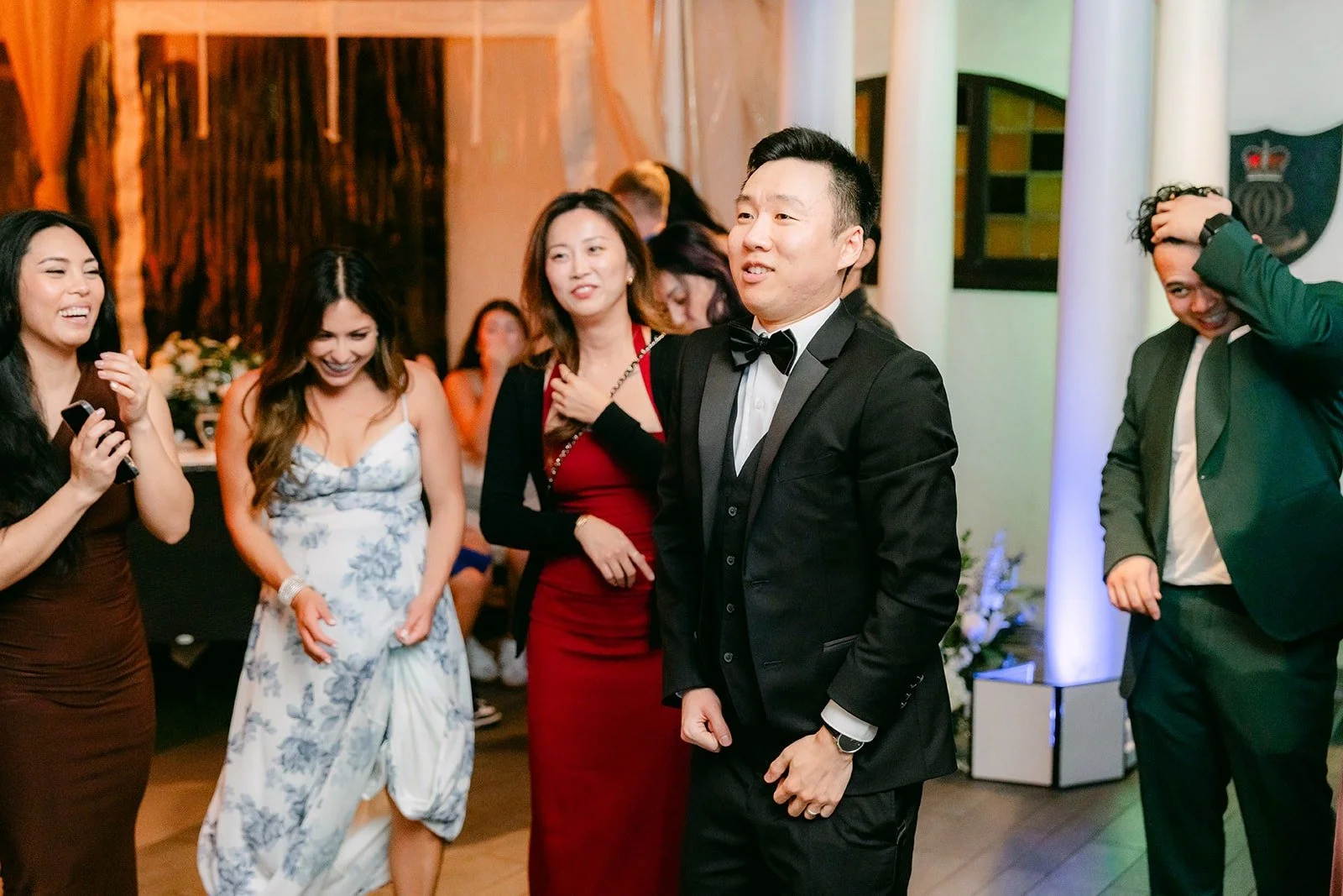 Jason dancing with friends on the packed floor