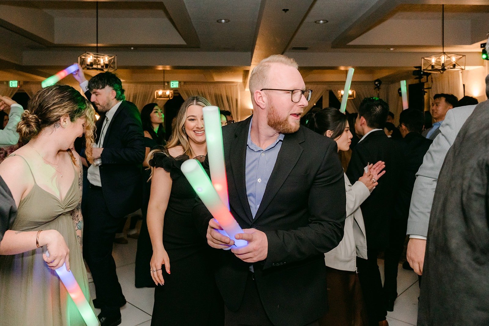 Guests dancing under the ballroom lights
